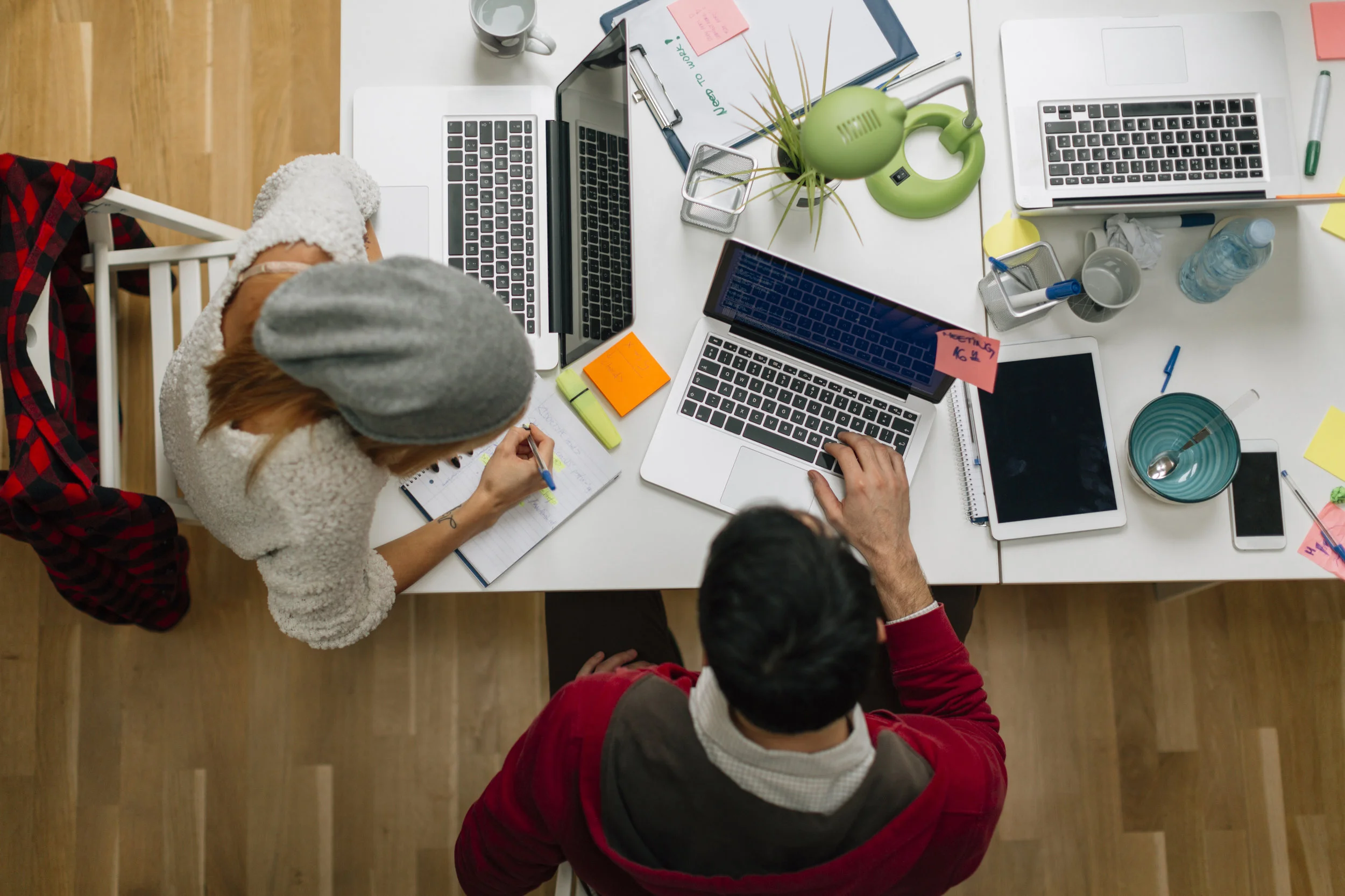 Two people working together at a desk