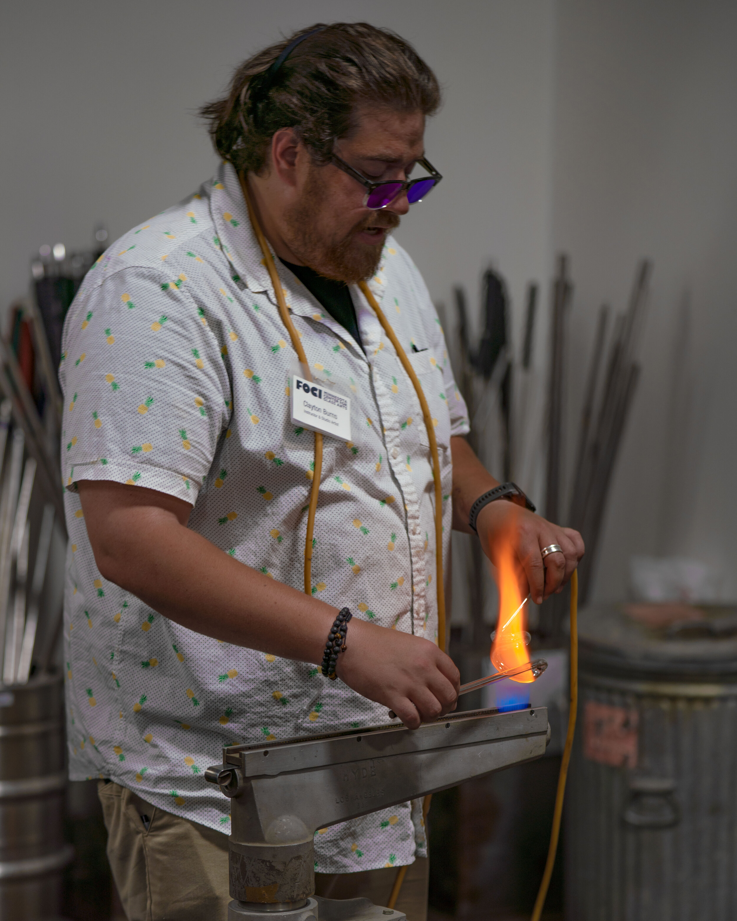  Instructor and Studio Artist Clayton Burns works on a neon demonstration. 