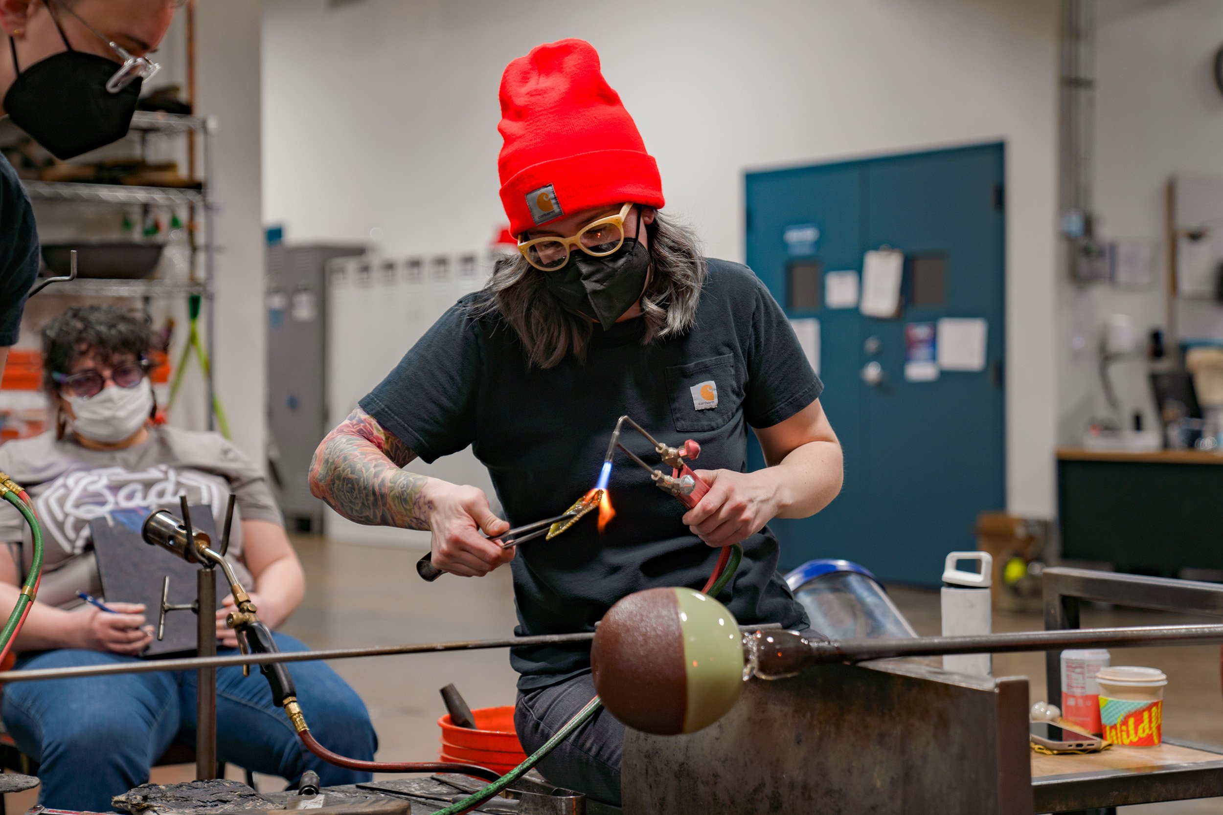 Megan Stelljes assembles a sculpture during a demonstration for students.