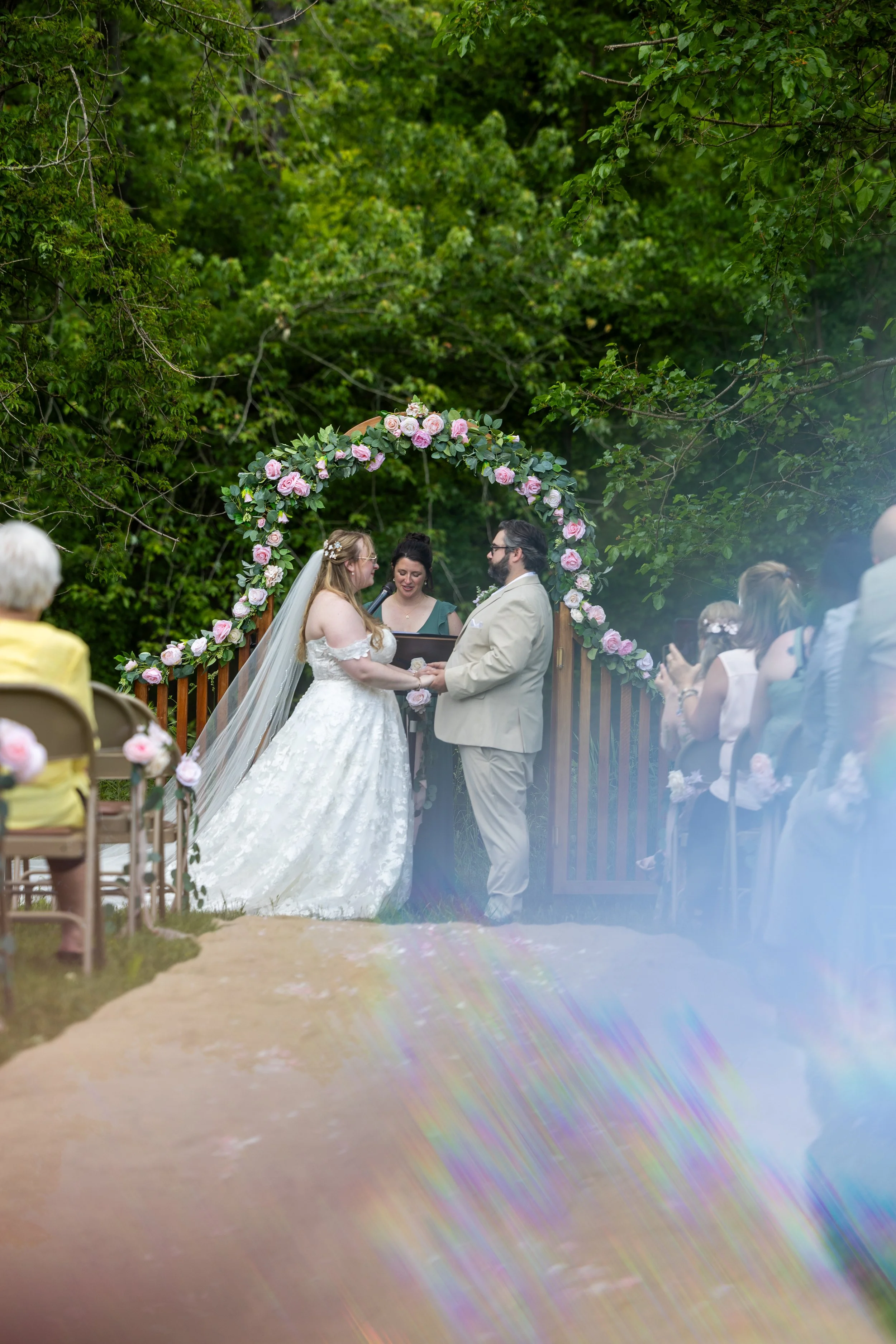 Bride and groom with officient