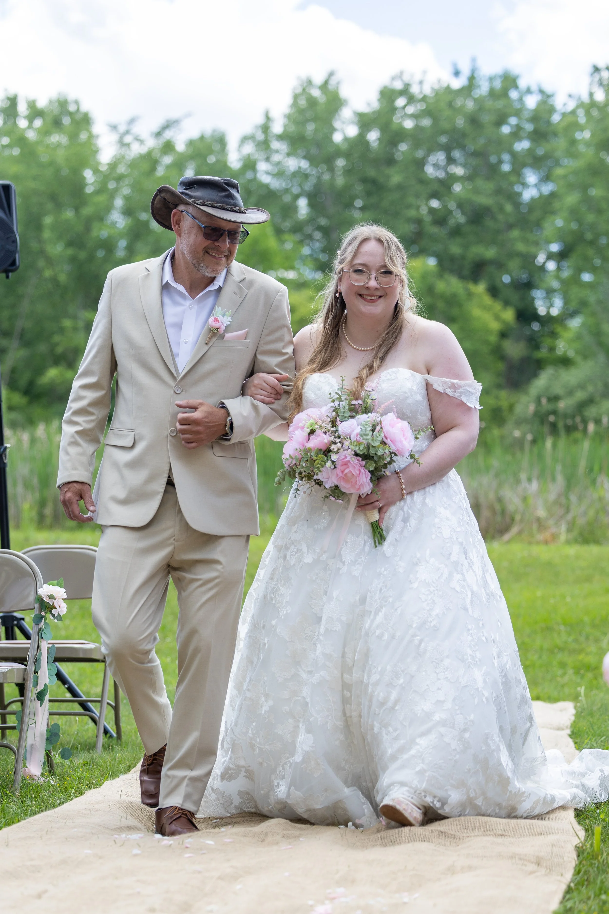 bride and dad walking aisle