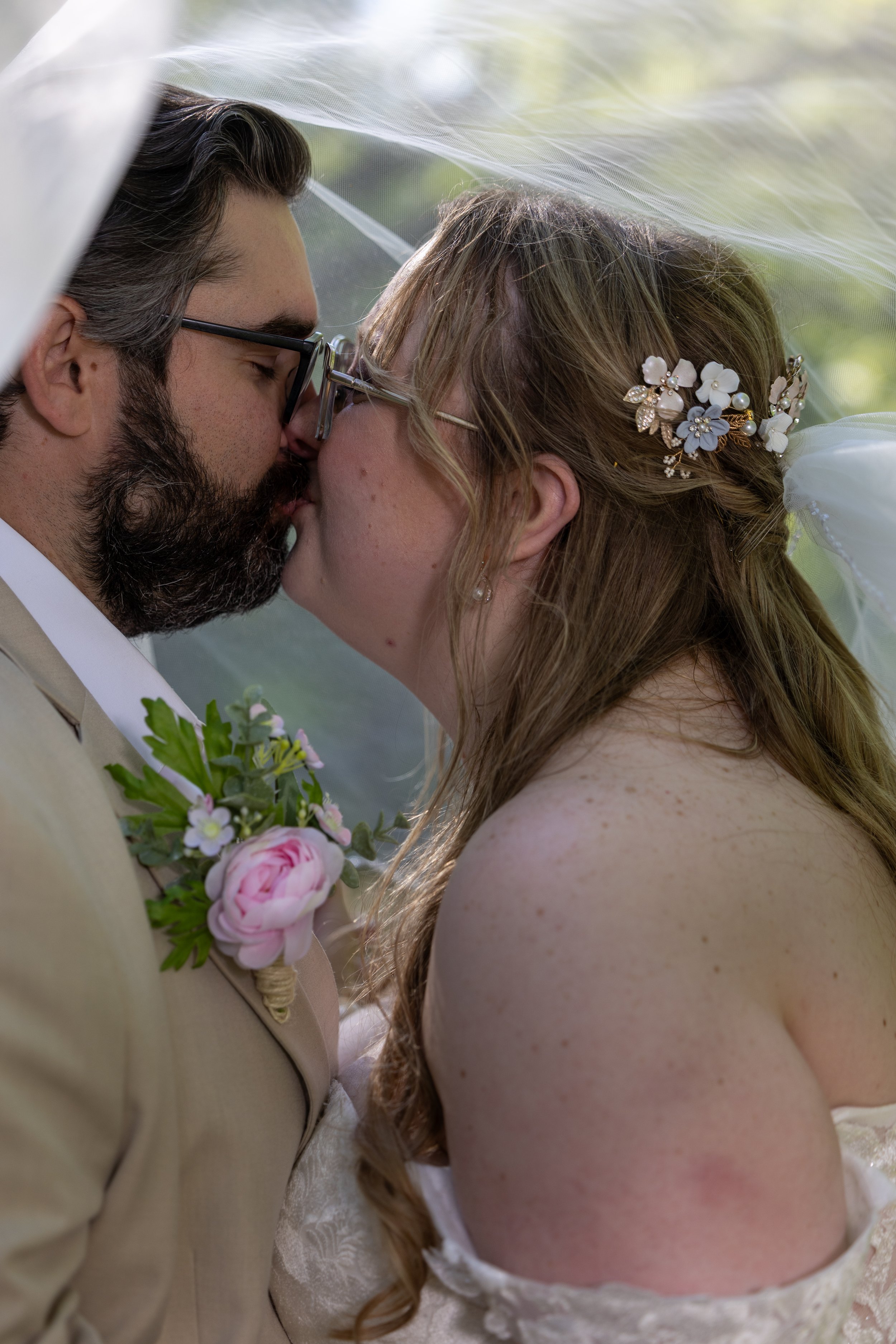 bride and groom kiss