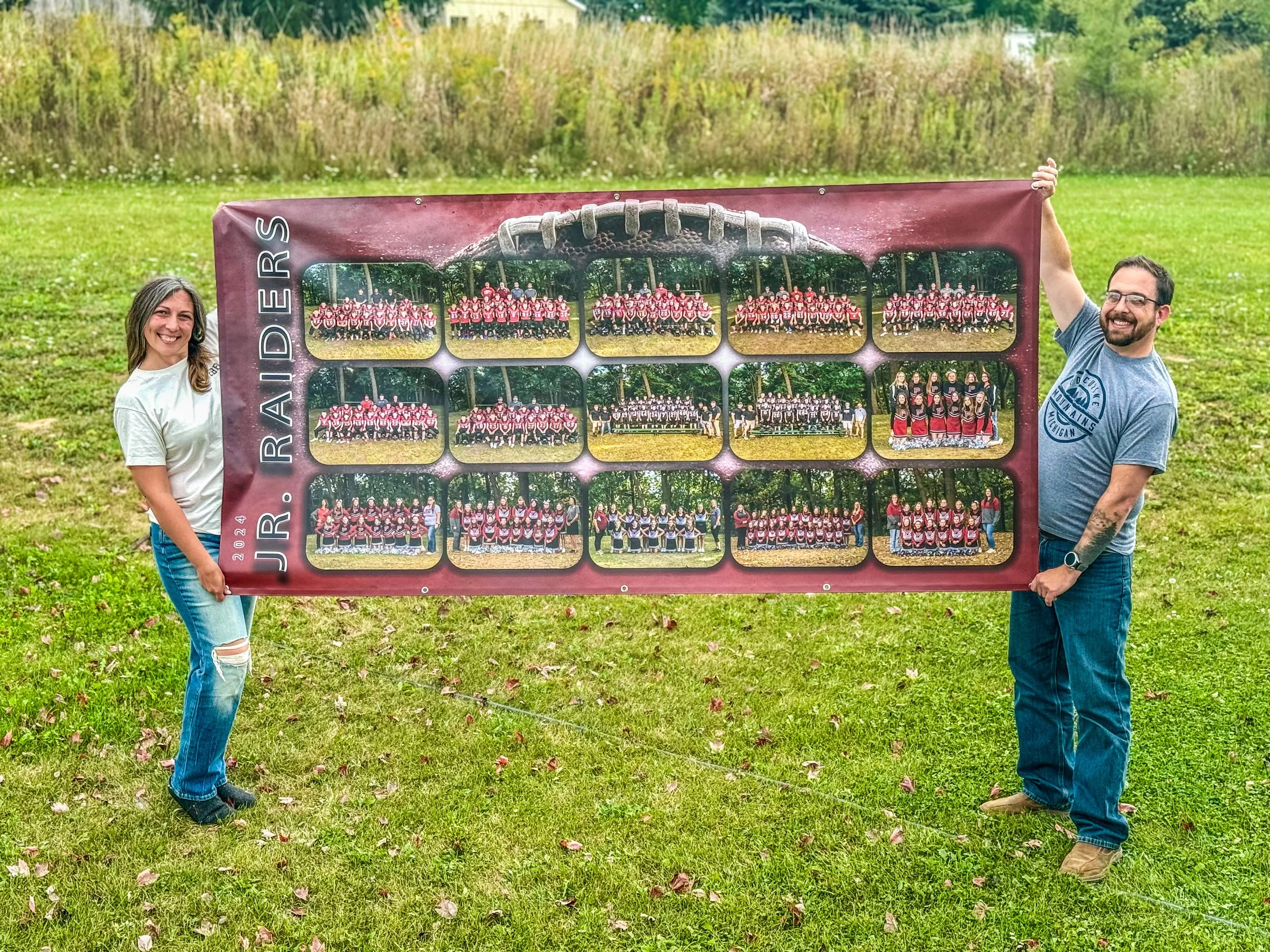 photographer with large banner