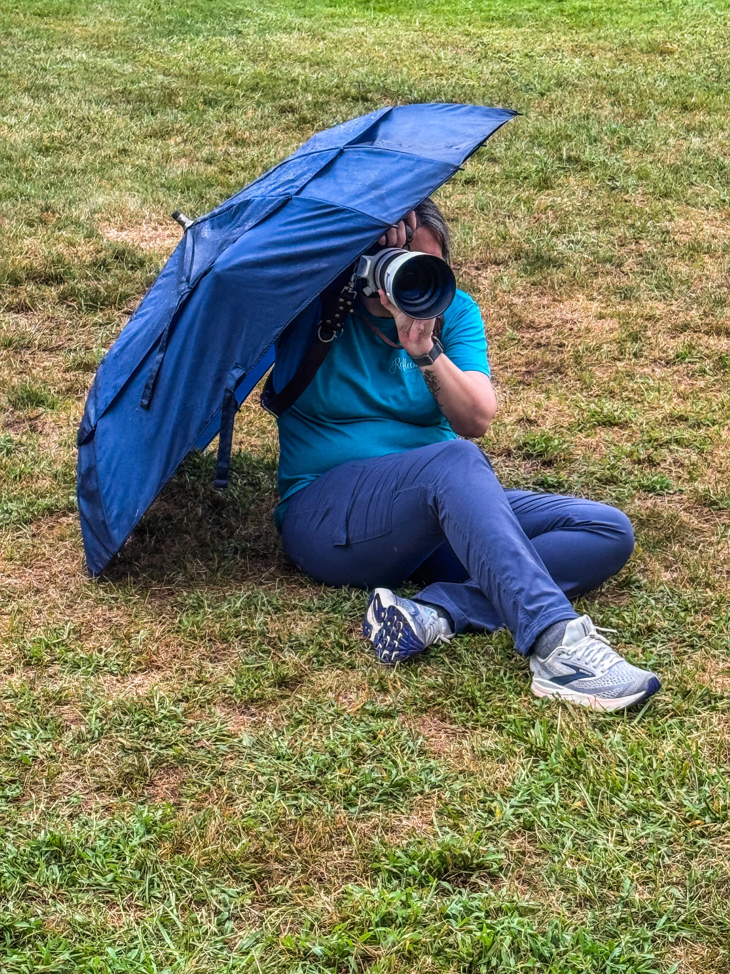 behind the scenes photographer with umbrella