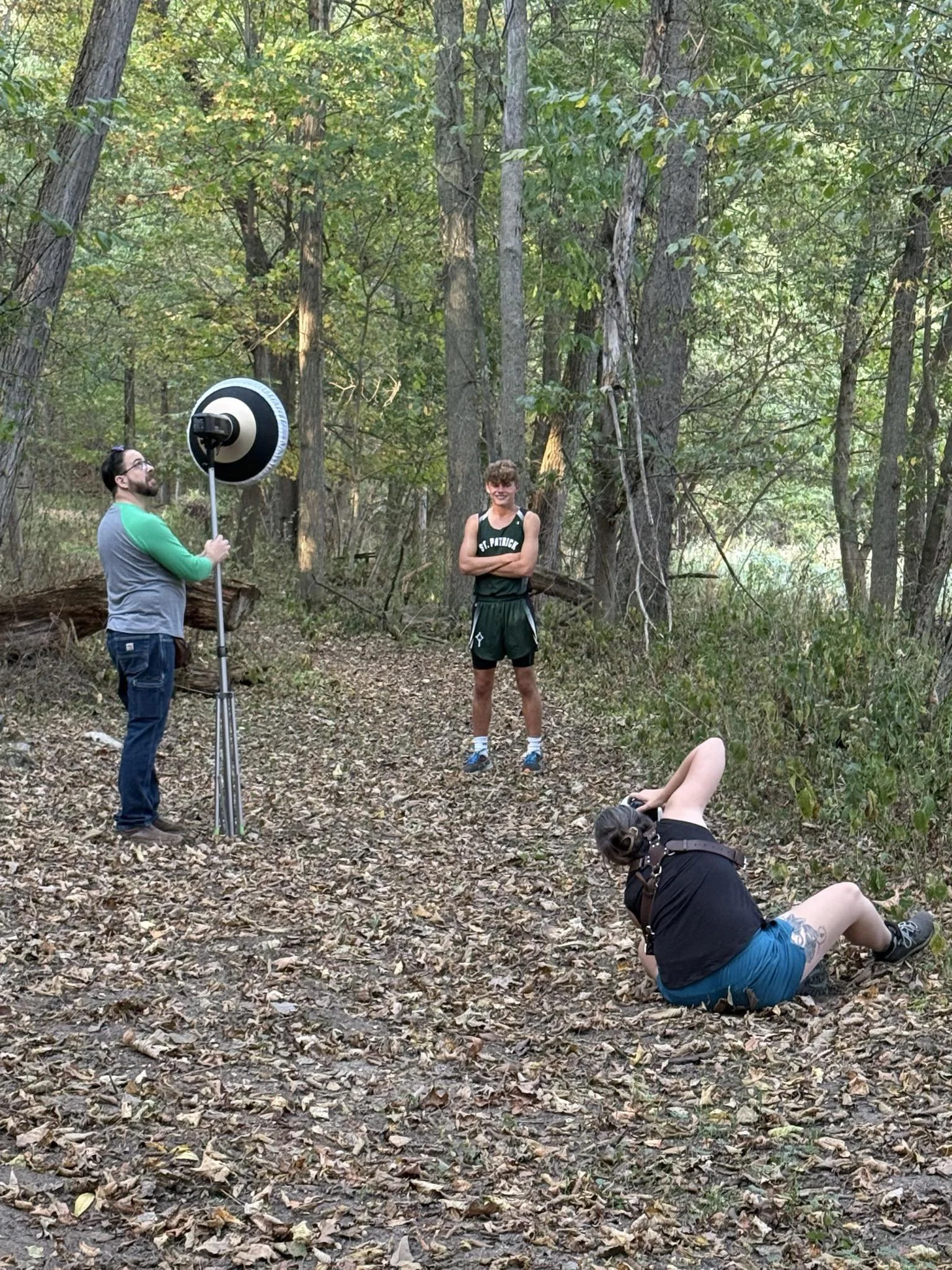photographer behind the scenes in a woods
