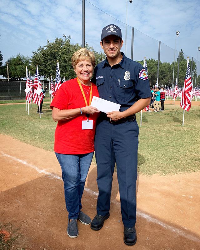 We were thrilled to deliver a donation to the @commfoundorange at the Field of Valor. These proceeds came from Team Orange&rsquo;s Professional Development BBQ event where @orangecityfirefighters provided the food, BBQ, and manpower and Team Orange&r