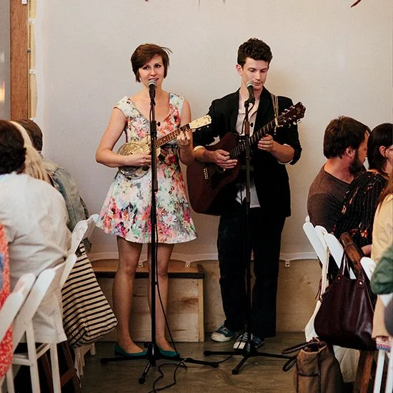 Amy and Eben Hoffer play music at the very first dining event for Spring Street Social Society