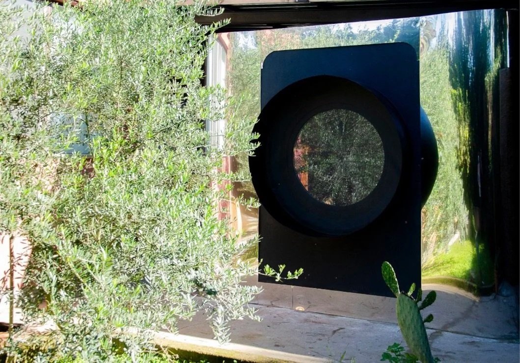 The Camera Tiny House is a project by Dora Tass inspired by the shape of the Hasselblad vintage camera.  The Camera is 17mq mobile tiny house, all furnished as a studio and a show room.