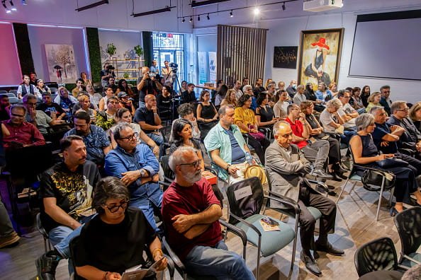 A diverse audience gathered for a multicultural community event