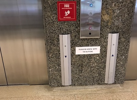 The elevator doors at GF Strong. Note the entirety of the metal plate acts as a button for patients in wheelchairs