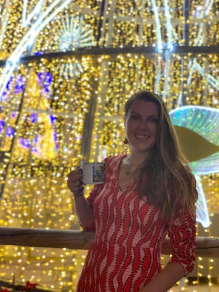 The famous Christmas lights on Calle Larios in Malga City centre with Pigsy's wife Enid posing with her Pigsy art mug