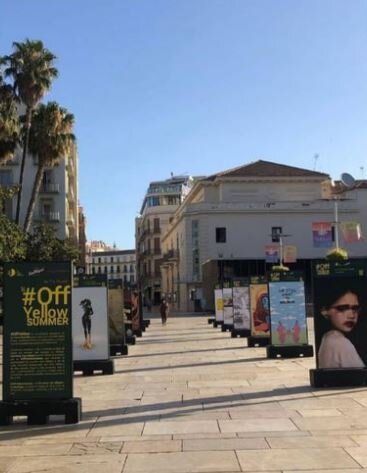 Off Yellow Summer Art Exhibition in Malaga Spain in front of Roman Ruins in the city 