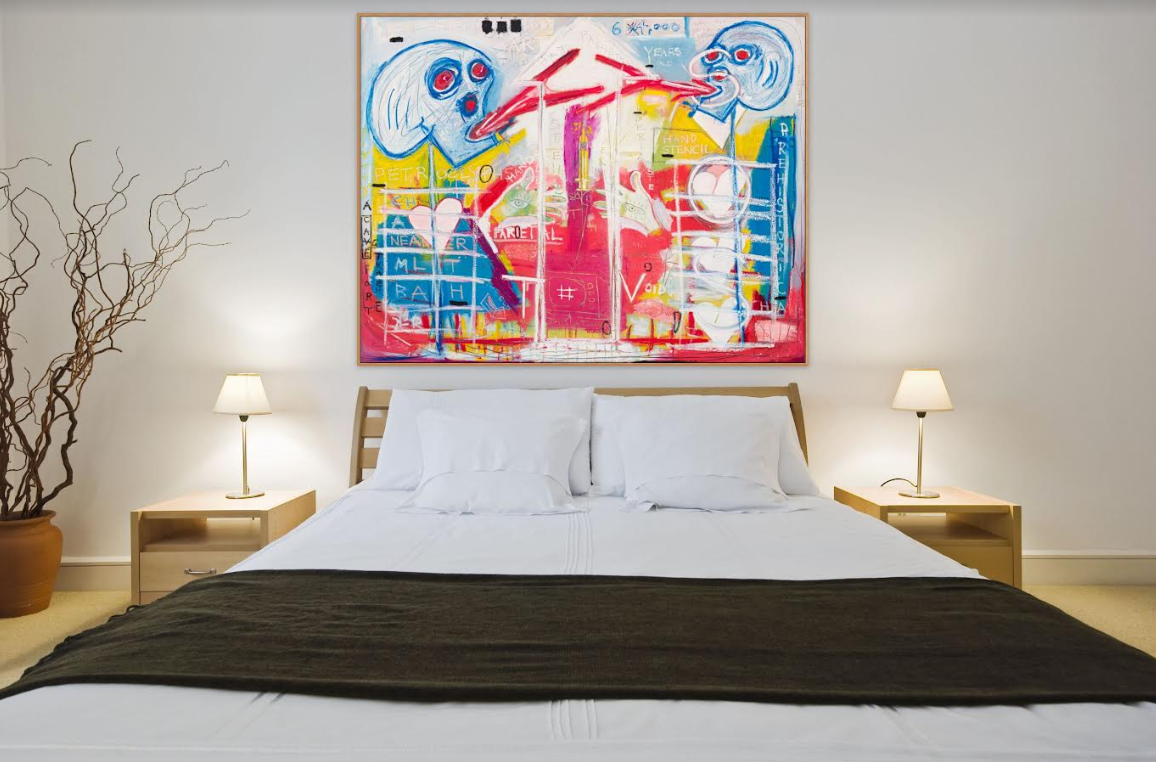 A painting above a bed