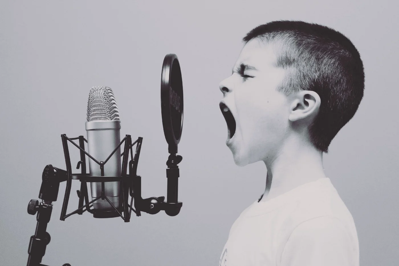 kid screaming into old mic Photo by Jason Rosewell on Unsplash.jpeg