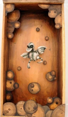 ODD DUCK I made this shadow box or diorama from a drawer left on the side of the road....I actually have a tool shed full of them (I confess!). I sculpted my little odd duck from Polymer Clay and painted him with acrylic paint. I sealed him with Sculpy glaze and used craft glue to put his vintage button eyes on. I carved and painted the wood layers or panels in the box from balsa and base wood. The box is fitted with a full size lamp light, and can hang on a wall as a lighting fixture or rest on a table top. Photo by Rebecca Duerr