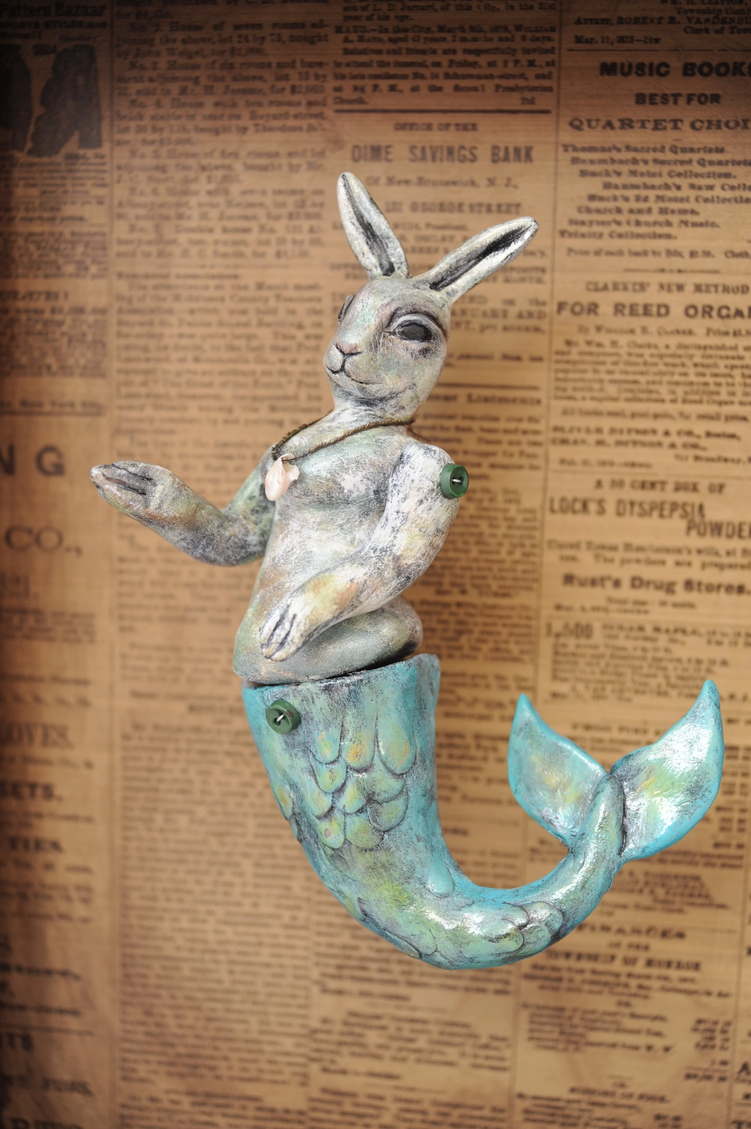 MERBUNNY Created as part of my Circus Curiosities series. Her arms and tail move. Sculpted from clay and set in a salvaged drawer. Lit with an electric light. Photo by Rebecca Duerr