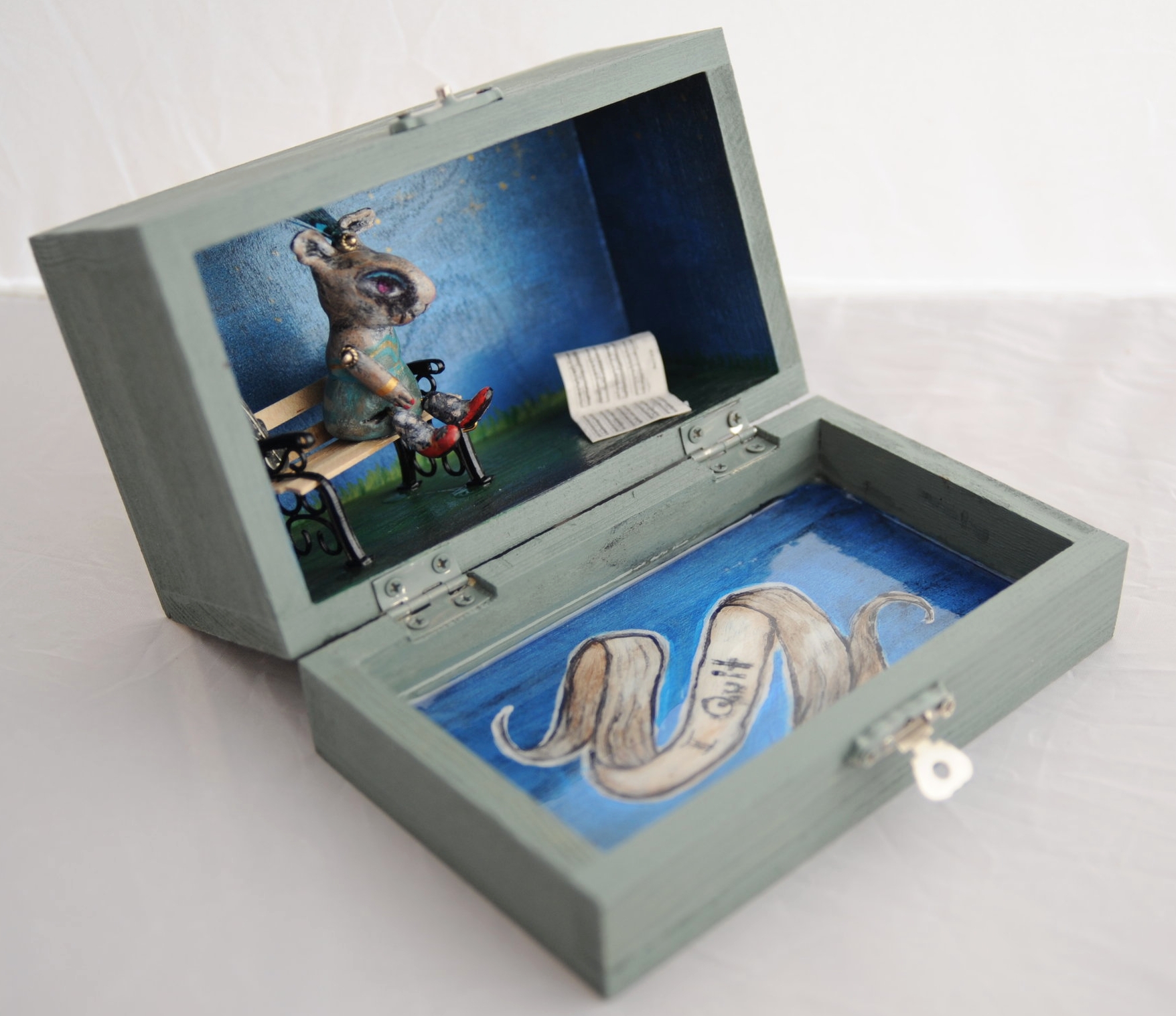 I QUIT I love making very small pieces. This figure is made of clay, hand painted and permanently set in a small wooden jewelry box. Photo by Rebecca Duerr