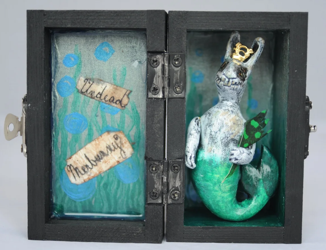 UNDEAD MERBUNNY I love making very small pieces. This figure is made of clay, hand painted and permanently set in a small wooden jewelry box. Photo by Rebecca Duerr