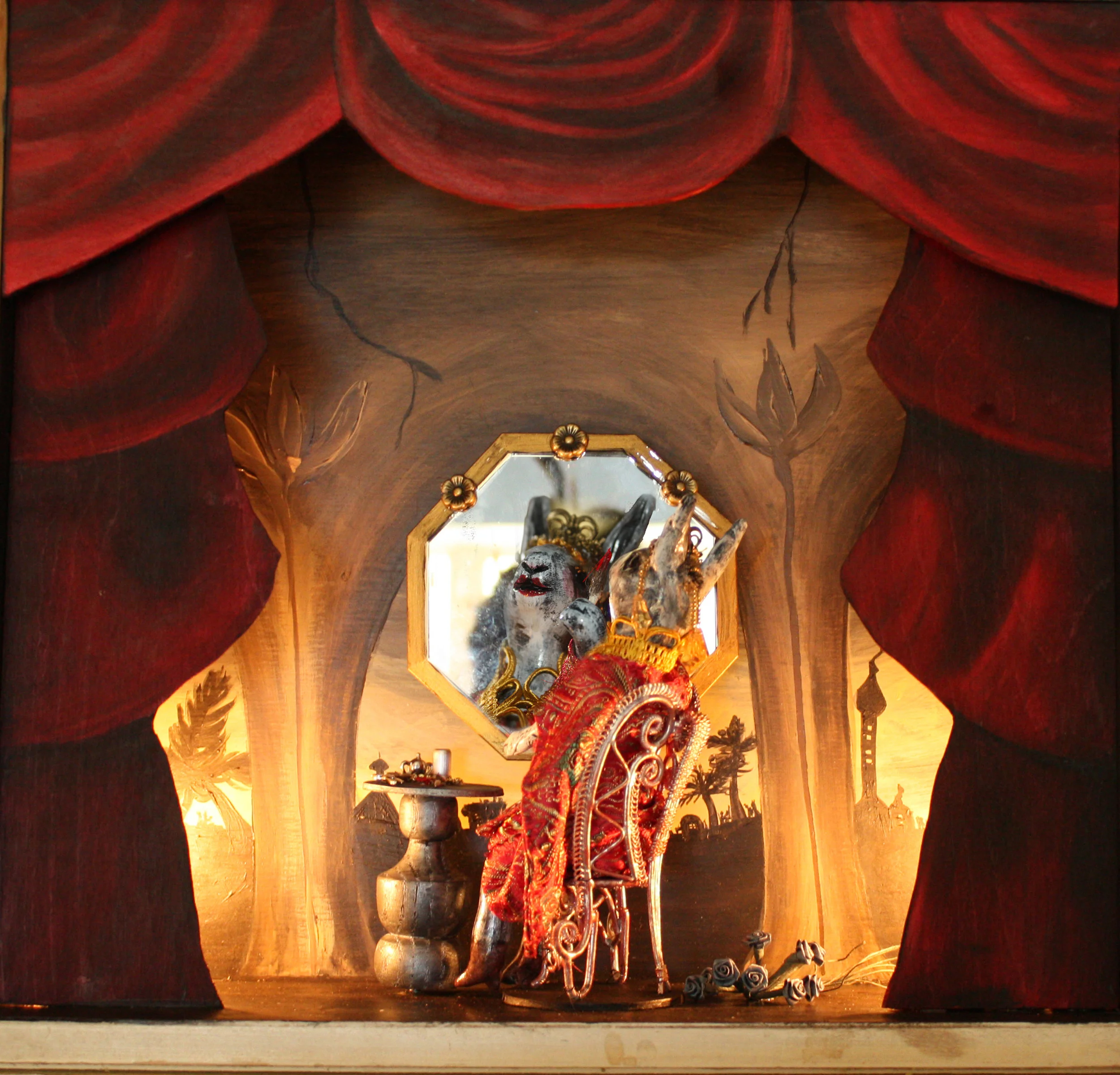 JEZEBUNNY Created as part of my "Bunny BIble Show" solor exhibition at Undergrounds Coffeehaus in Ft. Lauderdale, FL. Sculpted from clay, hand painted, hand sewn costume. Set in a salvaged drawer. Diorama elements hand carved and painted. "When Jezebel, the queen mother, heard that Jehu had come, she painted her eyelids and fixed her hair and sat at a window. Jehu looked up and saw her at the window and shouted, "Who is on my side?" And two or three eunuch guards looked out at him. "Throw her down!" Jehu yelled. So they threw her out the window, and her blood spattered against the wall and on the horses. And Jehu trampled her body under his horses' hooves." - 2 Kings 9:30 and following