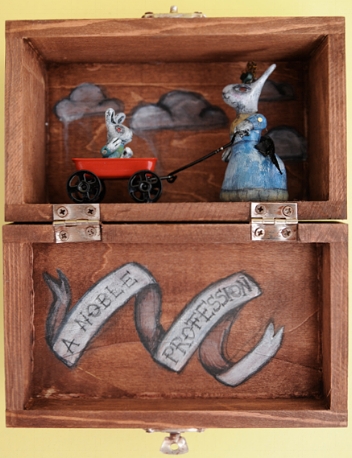 A NOBLE PROFESSION I love making very small pieces. This figure is made of clay, hand painted and permanently set in a small wooden jewelry box. Photo by Rebecca Duerr