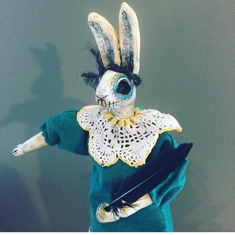 DAY OF THE DEAD CLOWN This Rabbit puppet was created in the Day of the Dead style. Cone puppets are set inside decorative cones. The puppeteer can pop the puppet in and out of the cone and swirl to make the puppet dance. The head and hands are sculpted with clay. Body made with wire so the arms can move. Costume hand sewn using vintage and new fabric.