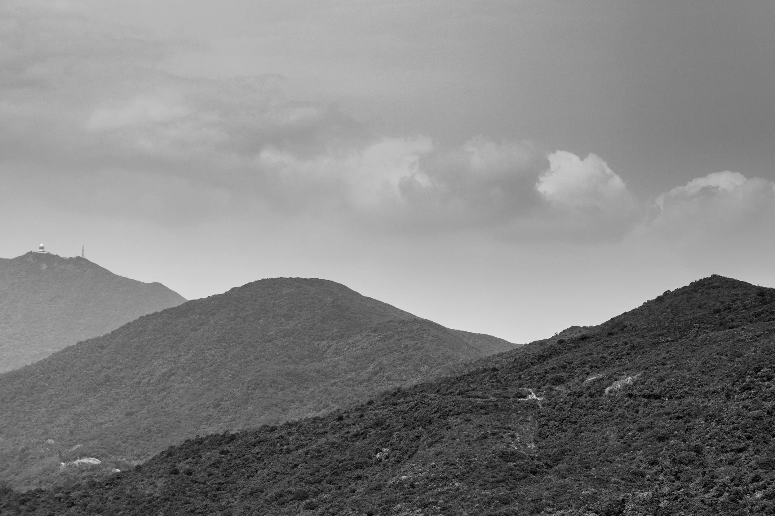 The haze in the air probably isn't great for hiking but it does make for some striking views like this I took when hiking along the Dragon's Back Trail in Hong Kong. I converted to black and white as it's really about the tones rather than the colours.