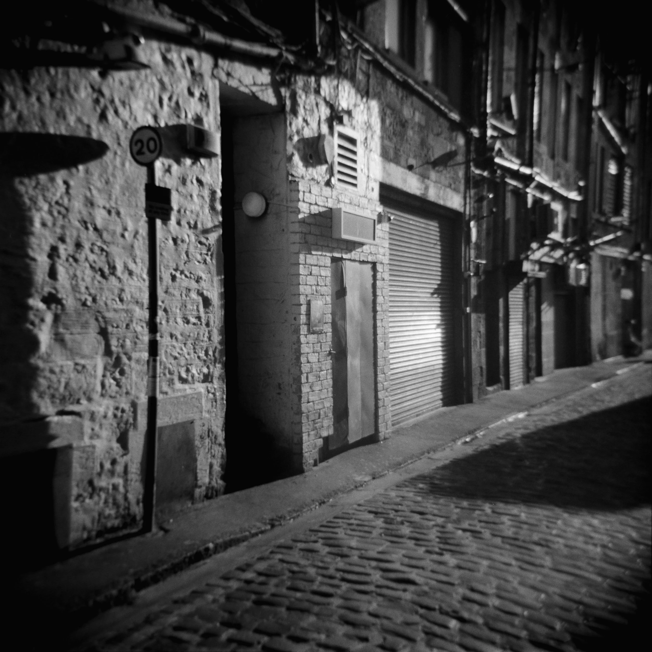 This is what happens when you expose for the highlights with an ancient camera (an Agfa Super Isolette from the 1950s). I might to have to get it checked out as it's usually very sharp and doesn't distort quite this much but on the other hand there's an awful lot of straight lines in the frame, many in the out of focus areas which will advertise any problems. As an aside it's also my first foray into DSLR scanning, seems to be working well and it's super fast compared to a flatbed. If you use an iPad instead of a light box like this scan the pixels give you a fairly neat newsprint type effect.