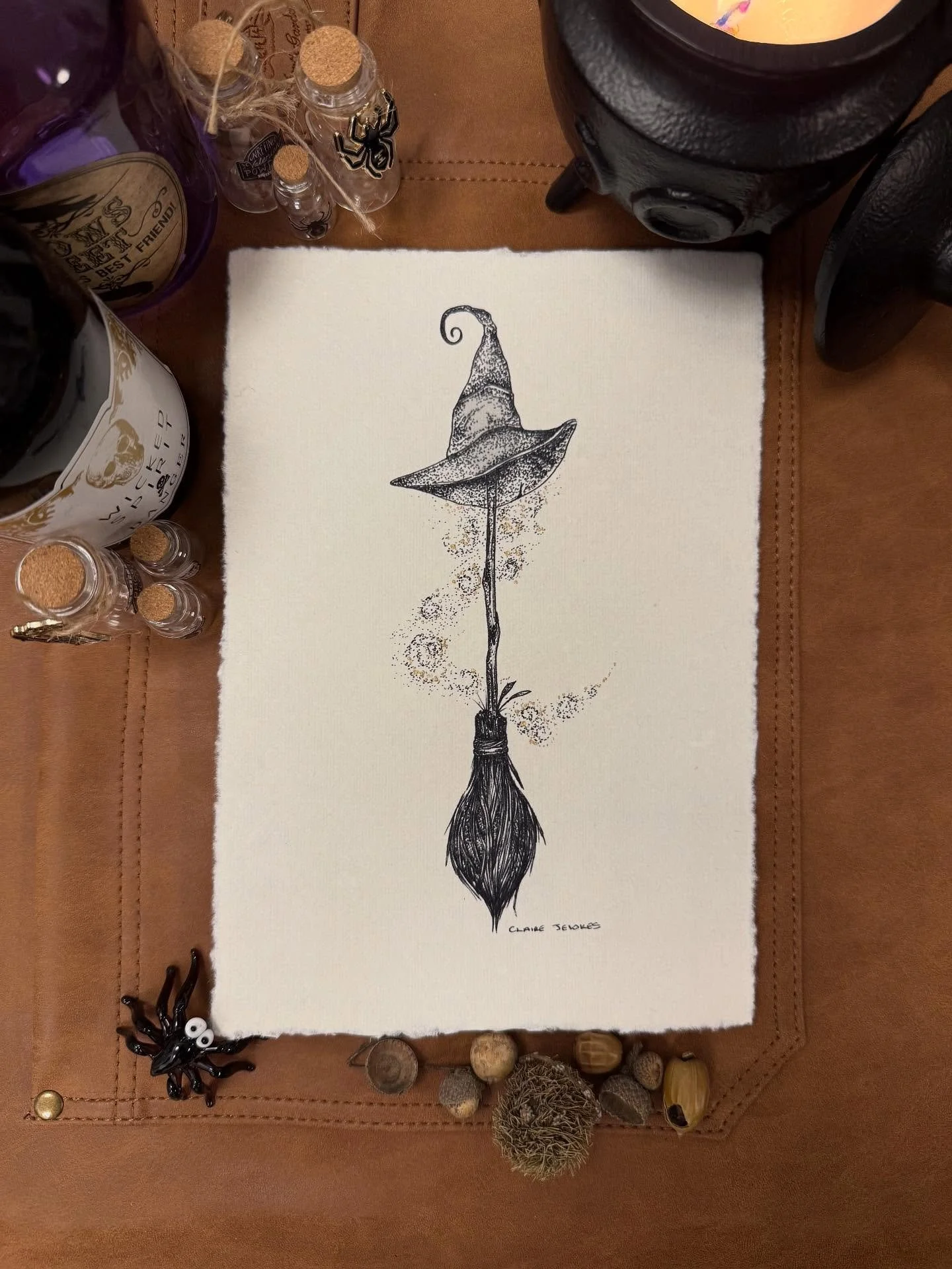 A quiet little spell in ink, a witch&rsquo;s hat and broom caught mid flight, leaving a trail of soft golden magic behind 🖤✨

Printed on handmade cotton paper with naturally deckled edges, textured, whimsical, and full of tiny details to get lost in