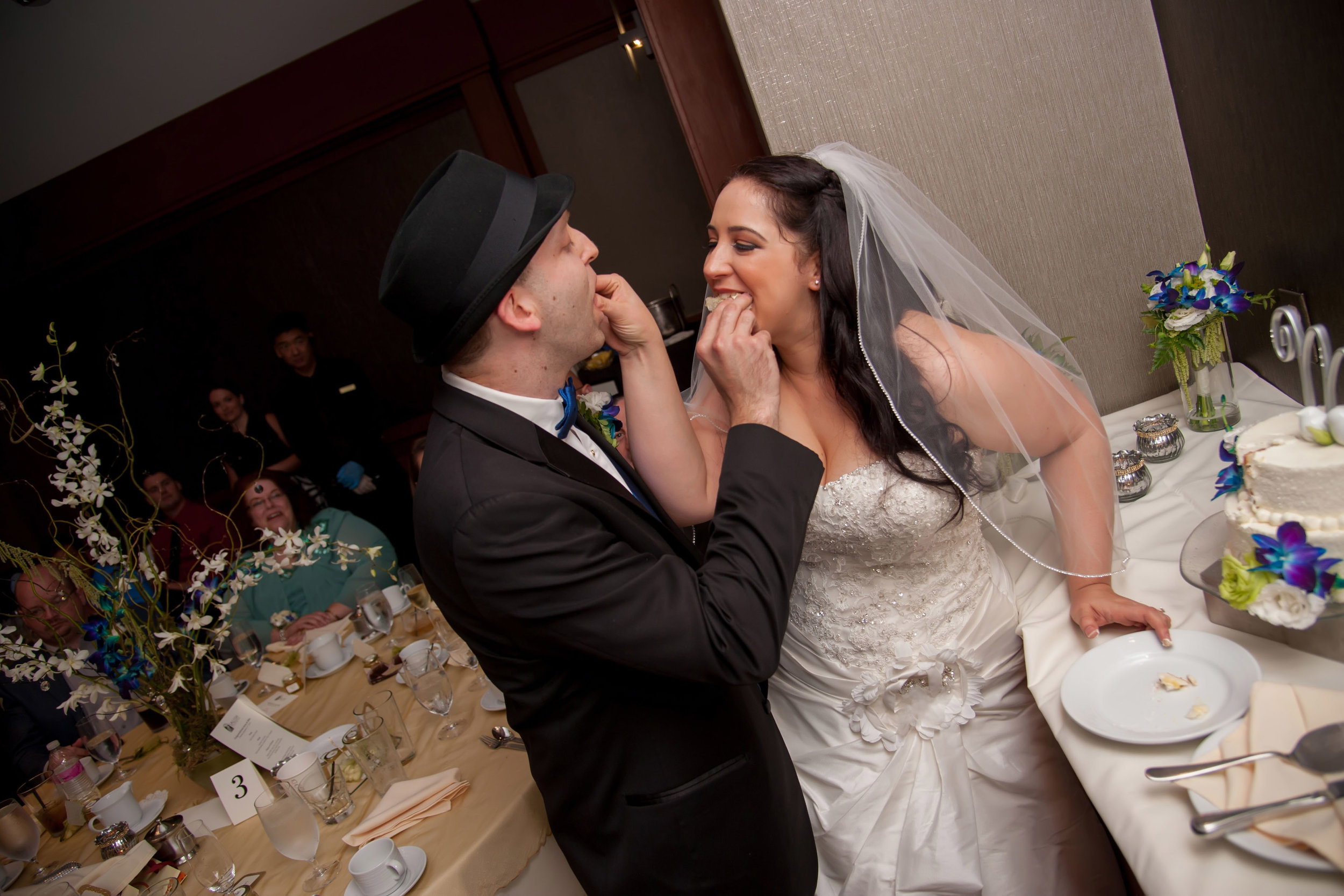 Bride & Groom Eating Cake.jpg