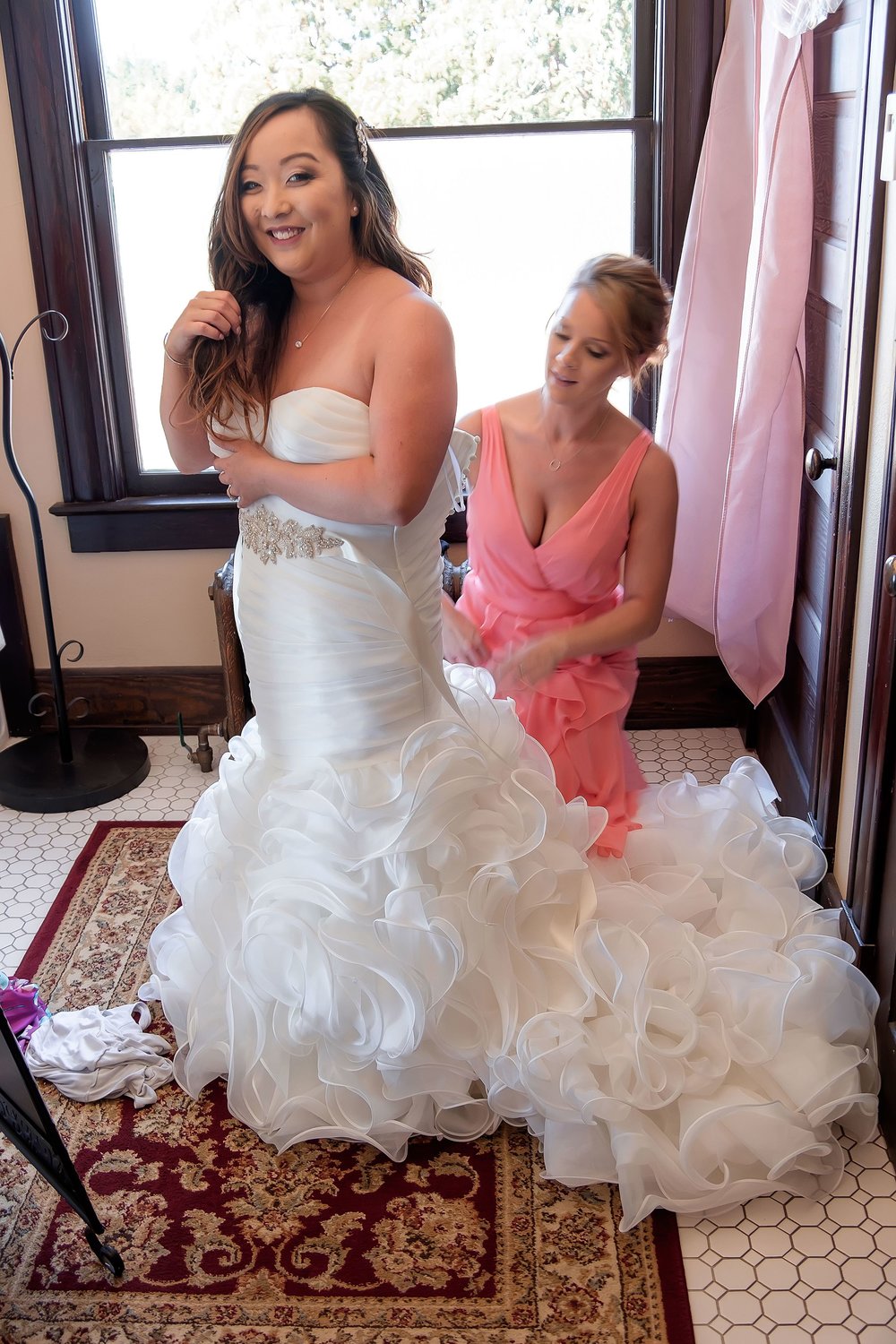 Bride getting into dress.jpg