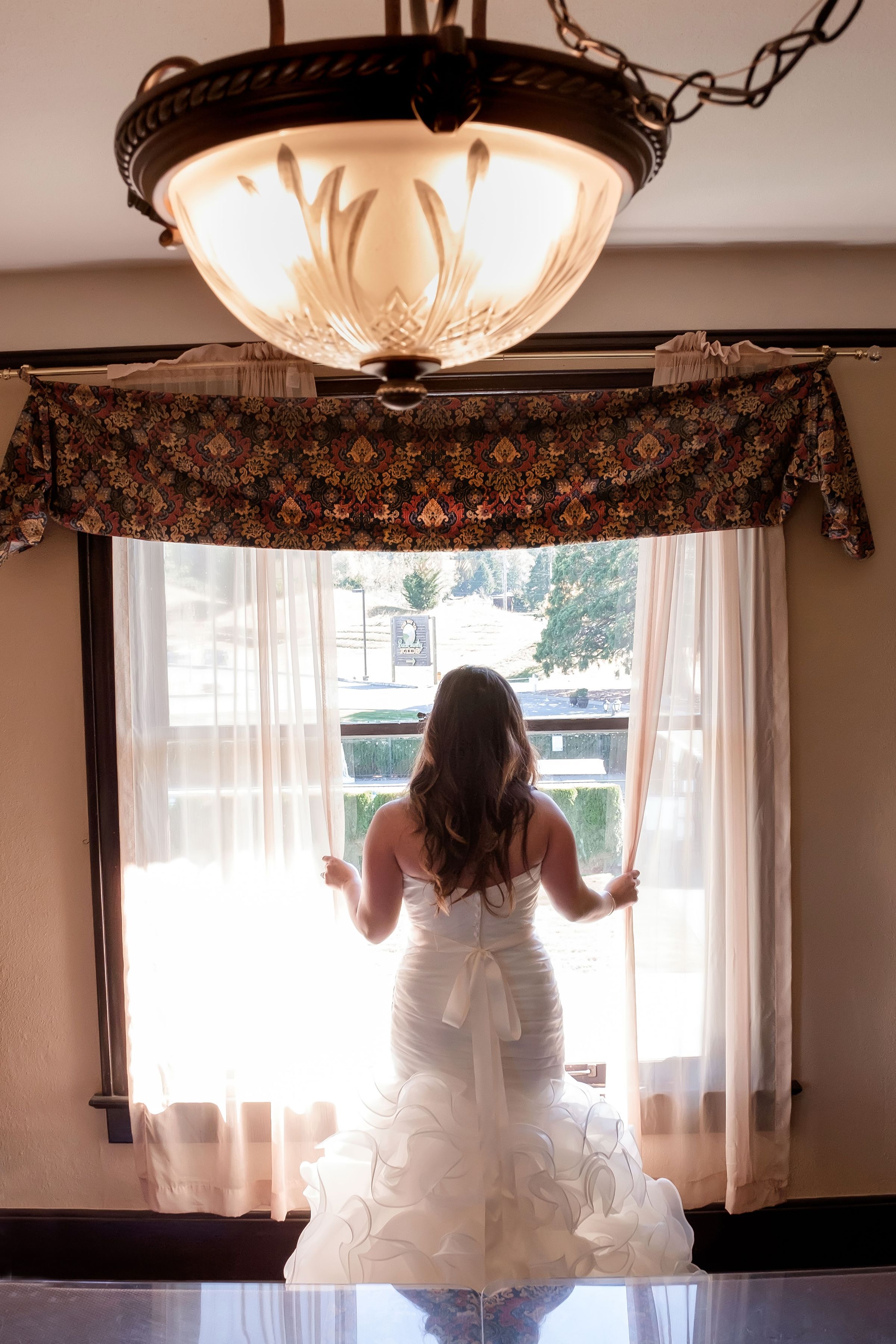 Bride looking out window.jpg