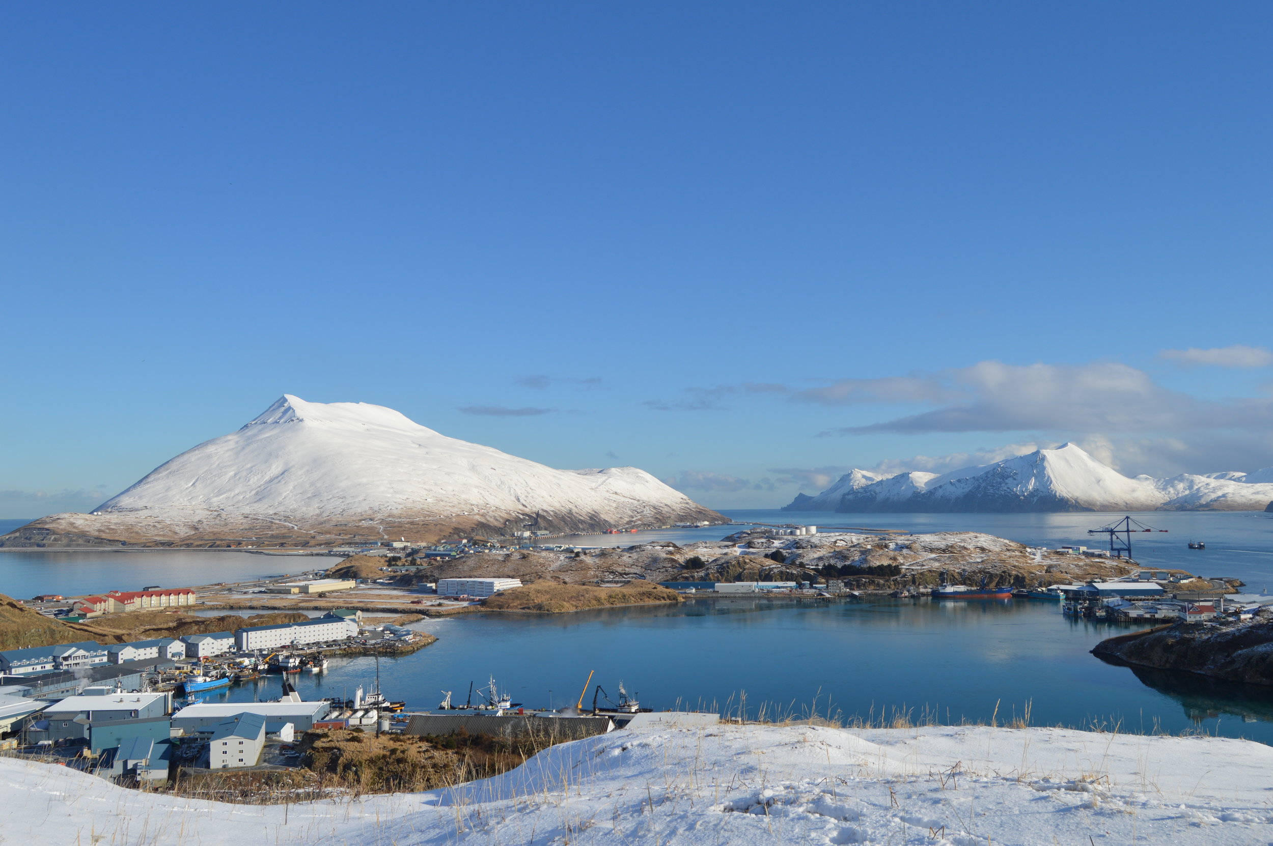 Port of Dutch Harbor in distance, city of Unalaska, Margaret Bay in foreground