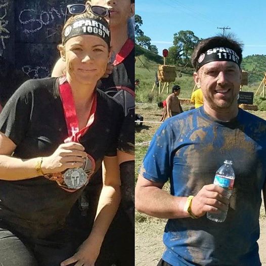 Sarah and tim showing off their Spartan race Medals