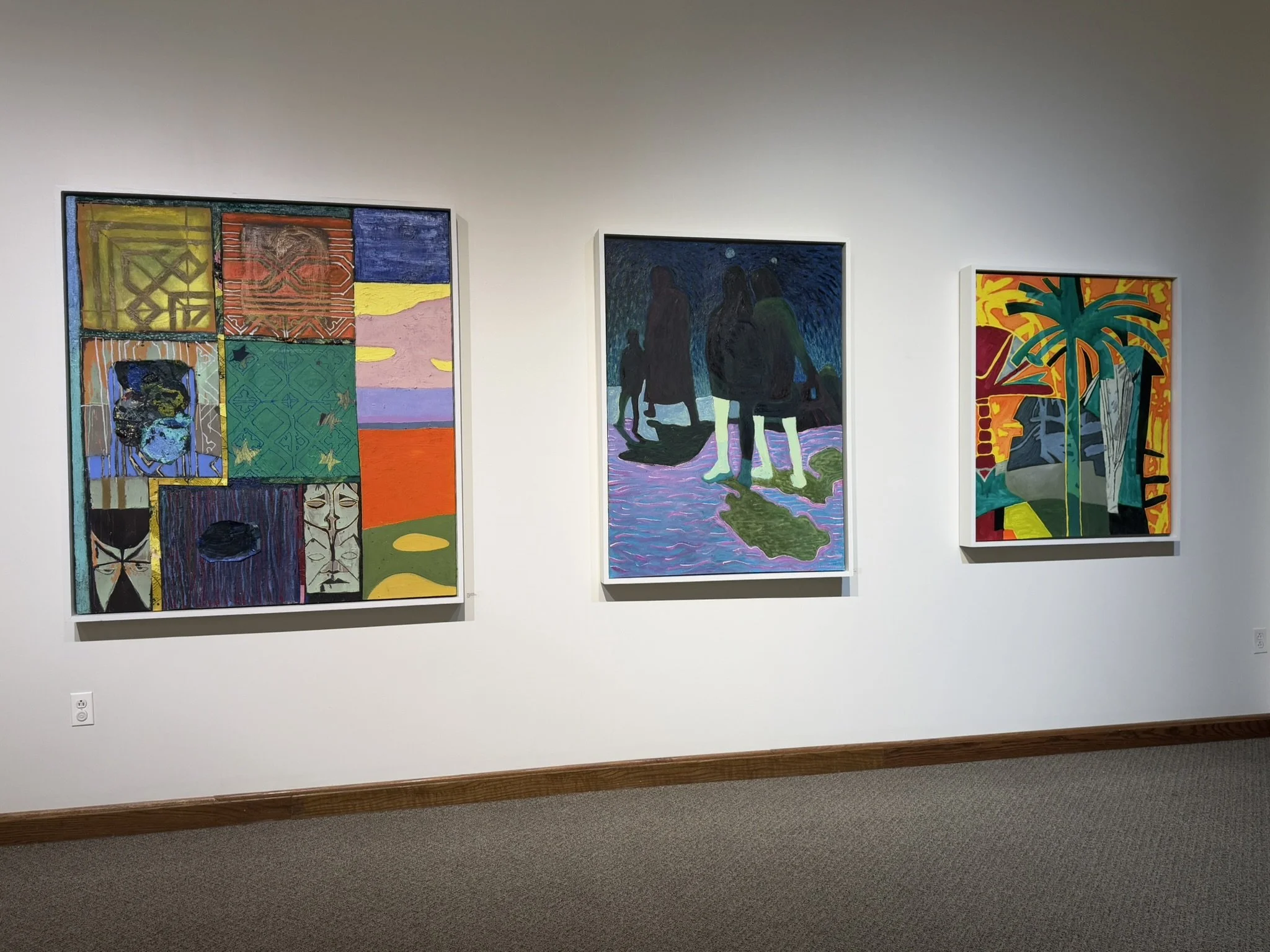 Three colorful abstract paintings hung on a white gallery wall.