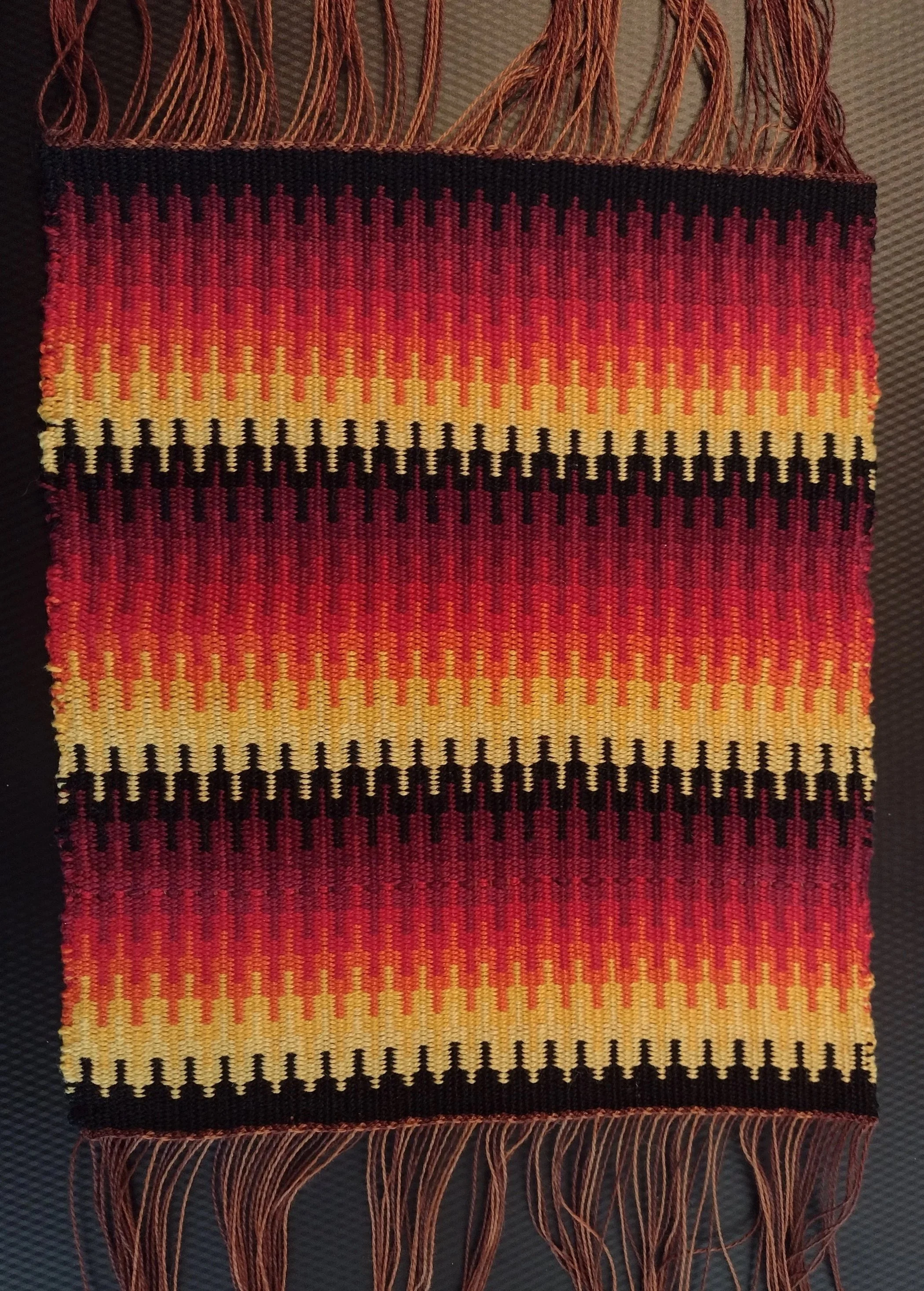  Woven by Becky Coalson  Loom: table. Warp: 8/2 cotton. Weft:  5/2 cotton. Sett: 12epi in a 10 dent reed.  
