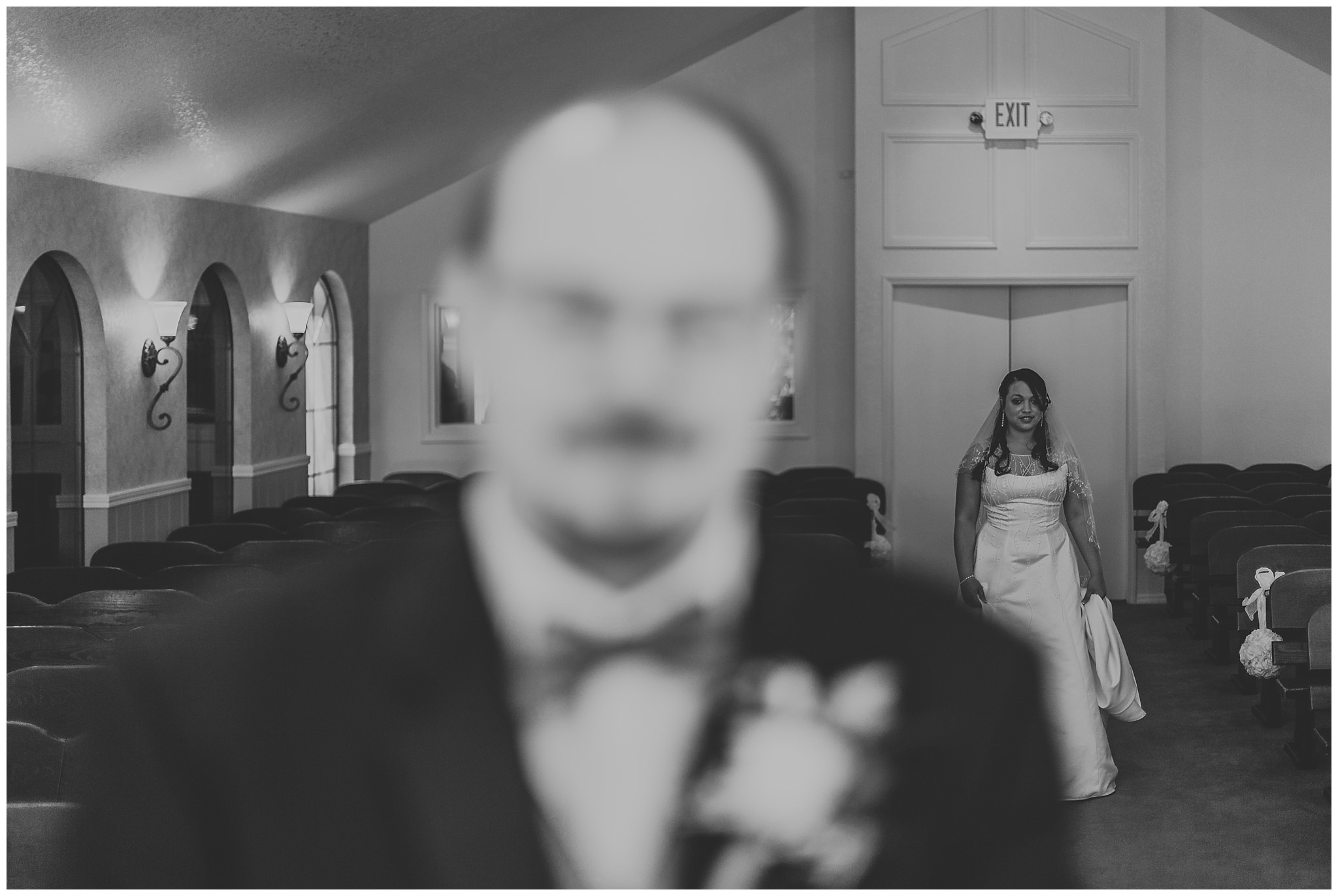 bride walking up behind groom for first look