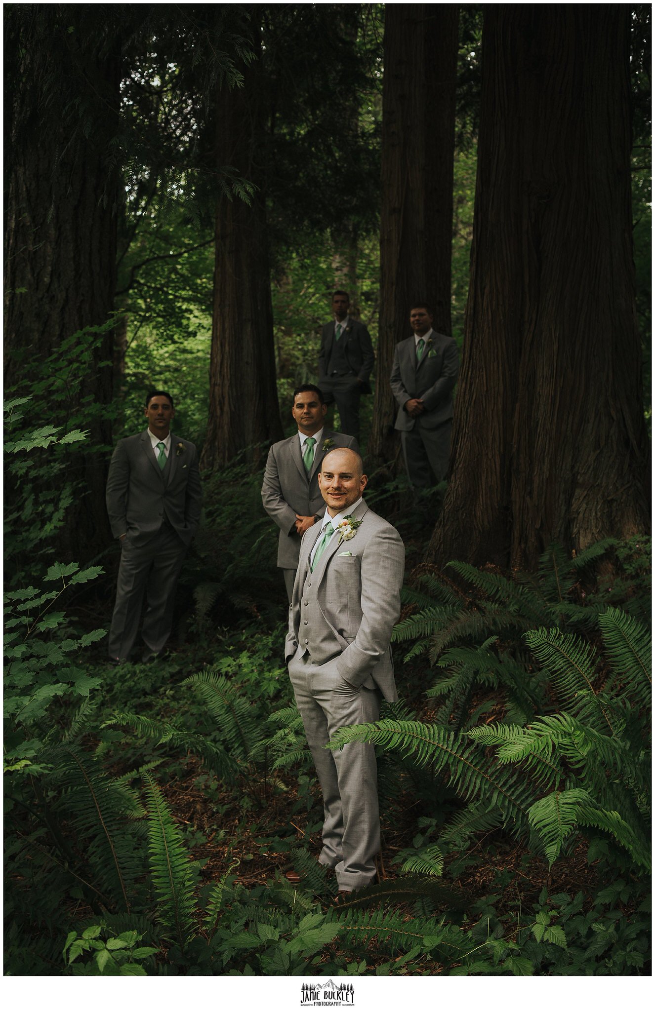 groom and groomsmen in trees before wedding