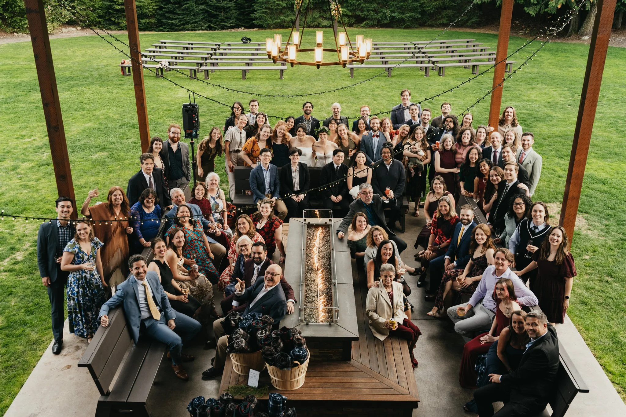 the entire wedding group poses for a photo on the patio at trinity tree farm