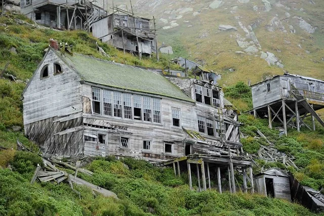 The abandoned schoolhouse and nearby houses at King Island village.