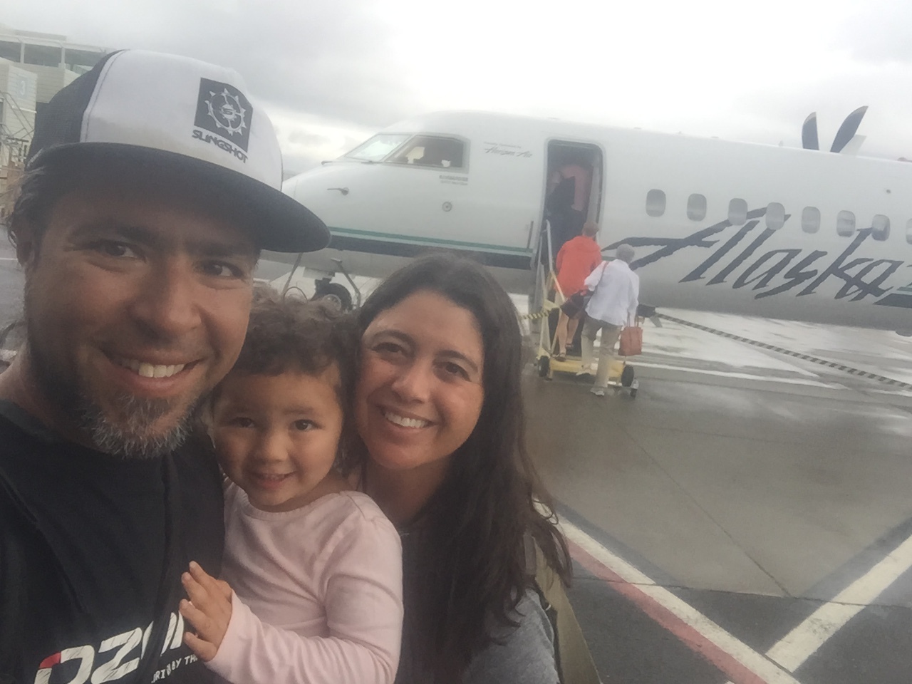 Verzone with daughter Maia and wife Ana boarding an Alaska Air jet.