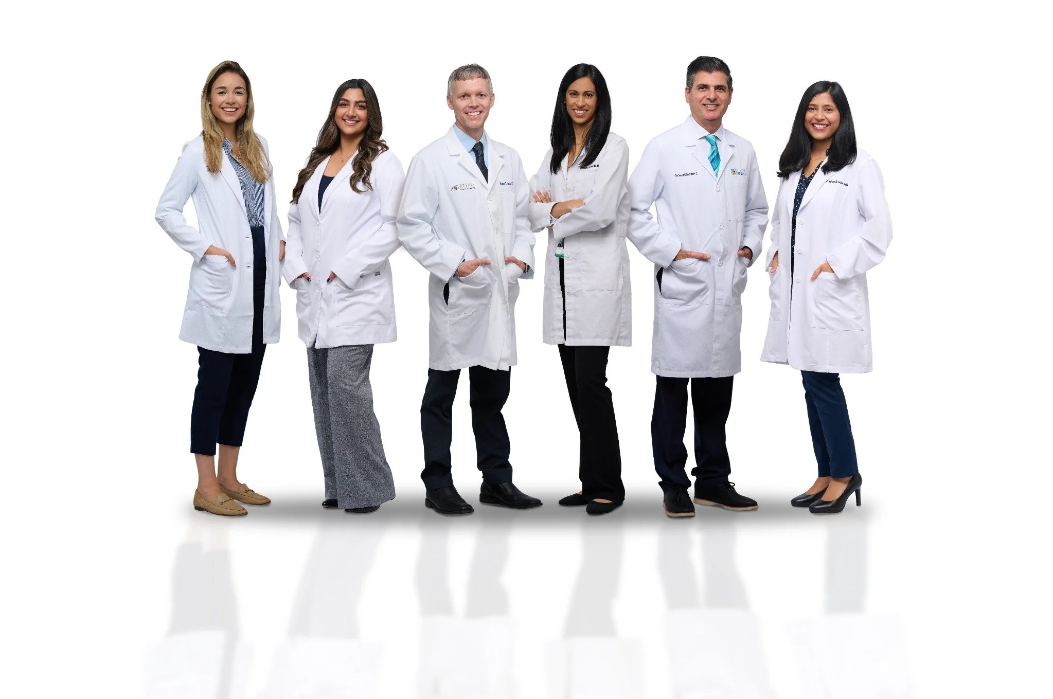Six Sarasota healthcare providers in white coats photographed together by SRQ Headshots