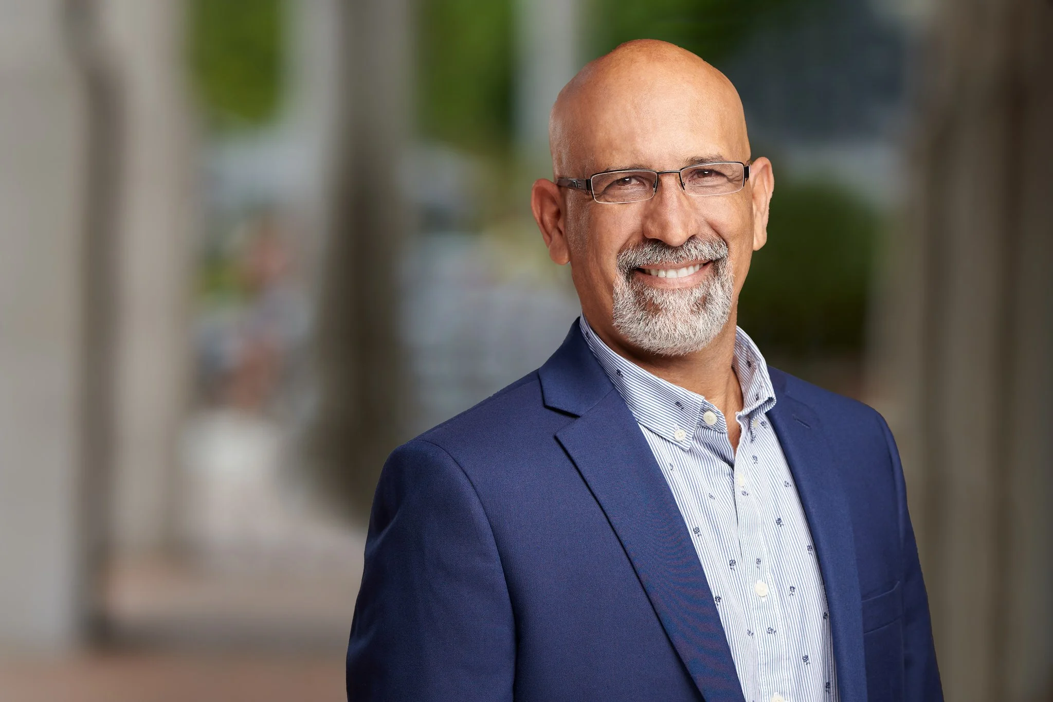 LinkedIn headshot of a business professional with a confident and approachable expression