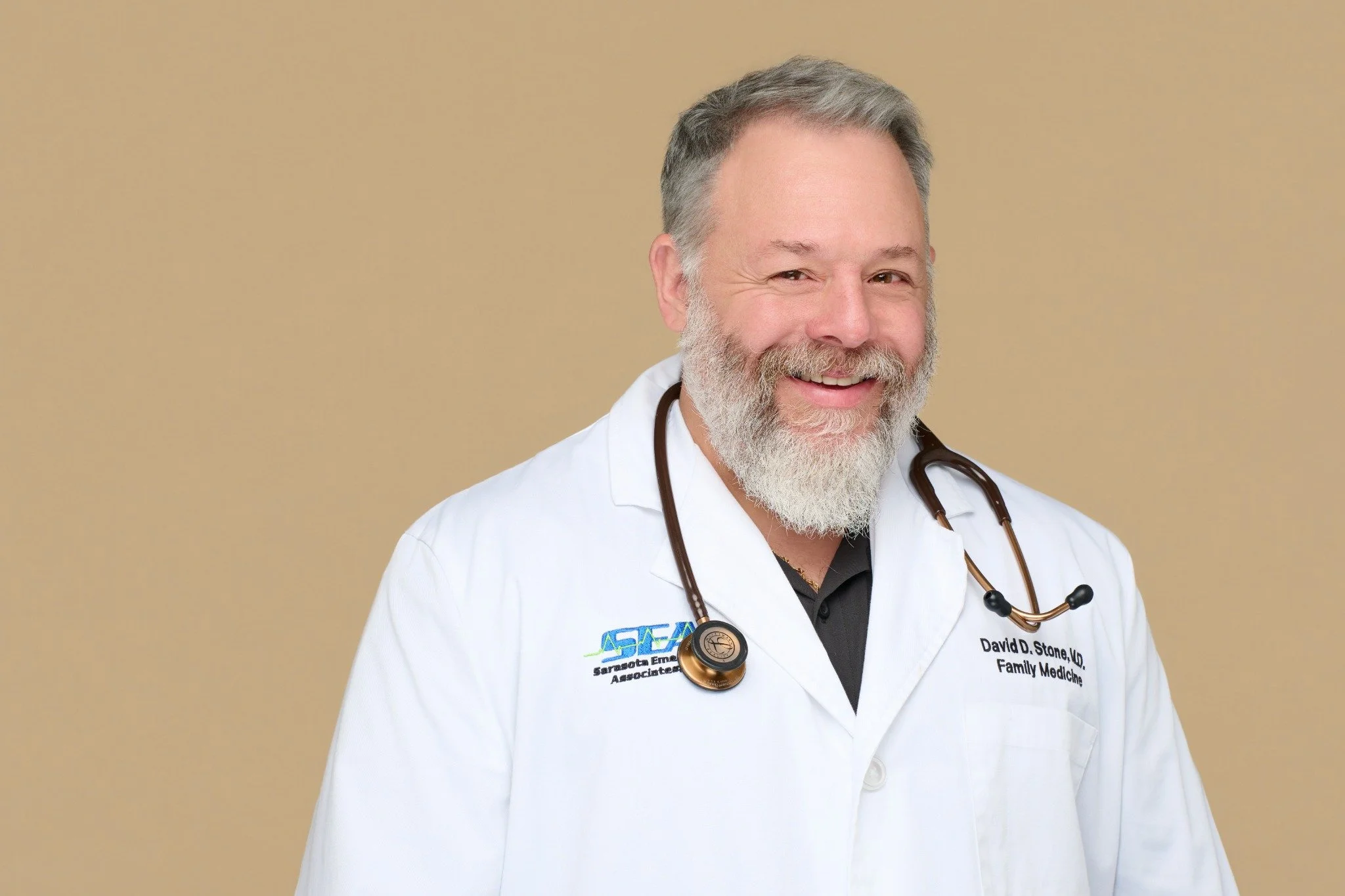 Sarasota family medicine physician photographed by SRQ Headshots in a white coat