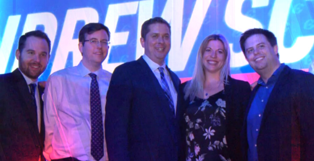 Conservative Leader Andrew Scheer, middle, poses with some members of his leadership campaign team at the Conservative leadership convention in May. From left, Marc-André Leclerc, Hamish Marshall (a former director for Rebel Media), Scheer, Kenzie Potter and Stephen Taylor. (CBC)