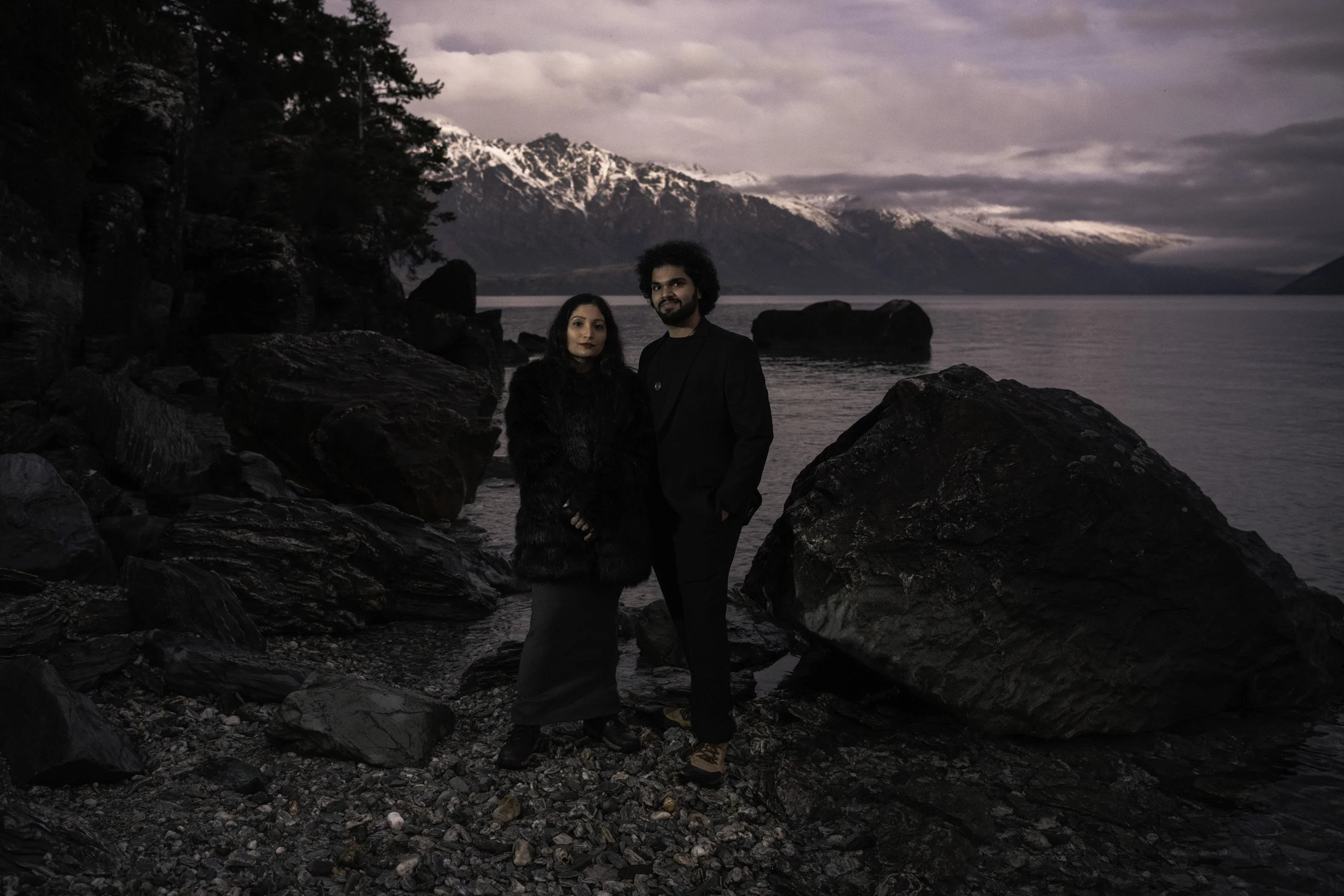 Beautifully dressed couple enjoying the last of the light over Whakatipu-Wai-Māori - Pre Proposal photoshoot - curated and delivered by authenticAs