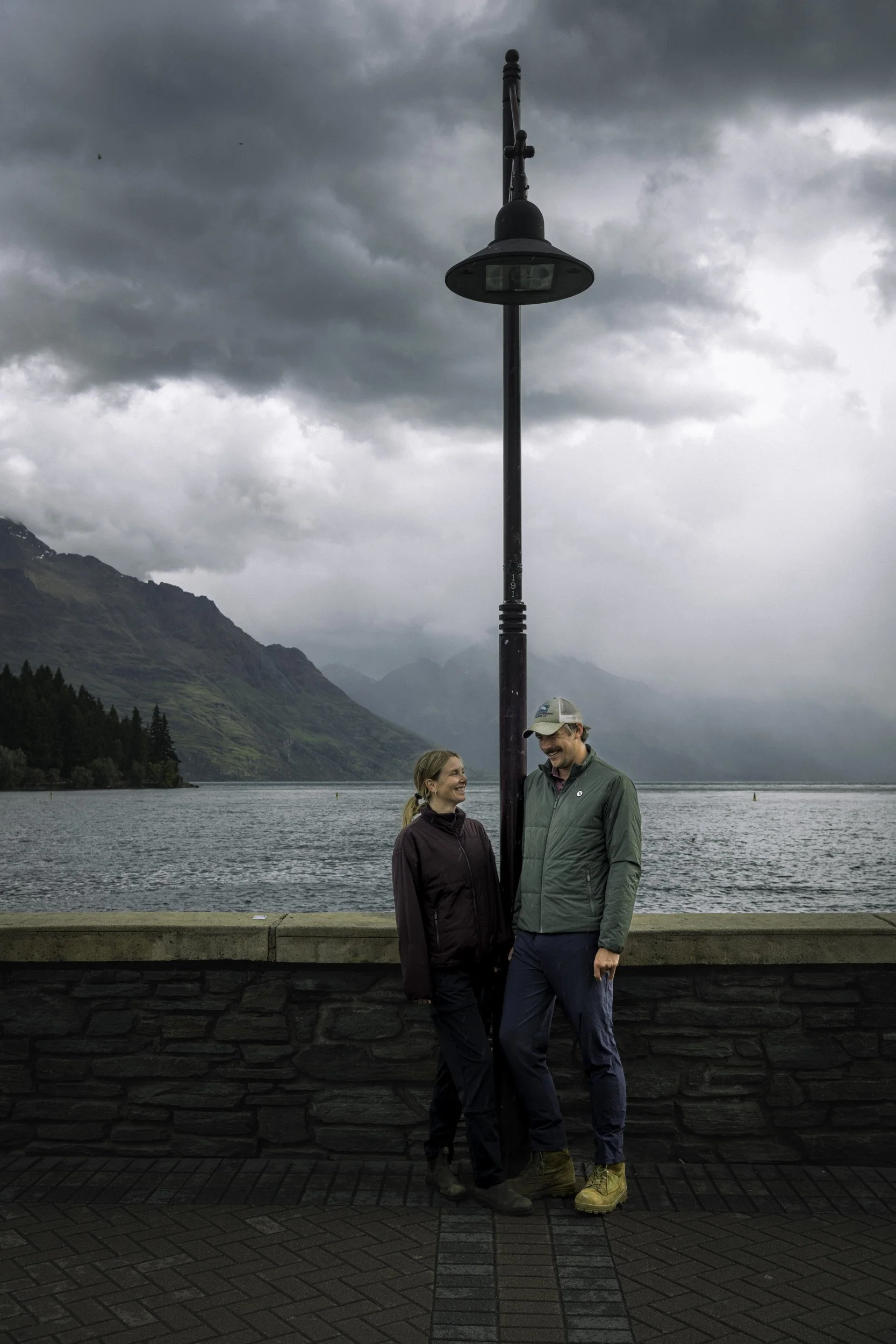 Honeymooners starting their adventure at Queenstown Bay, professionally photographed on a guided tour