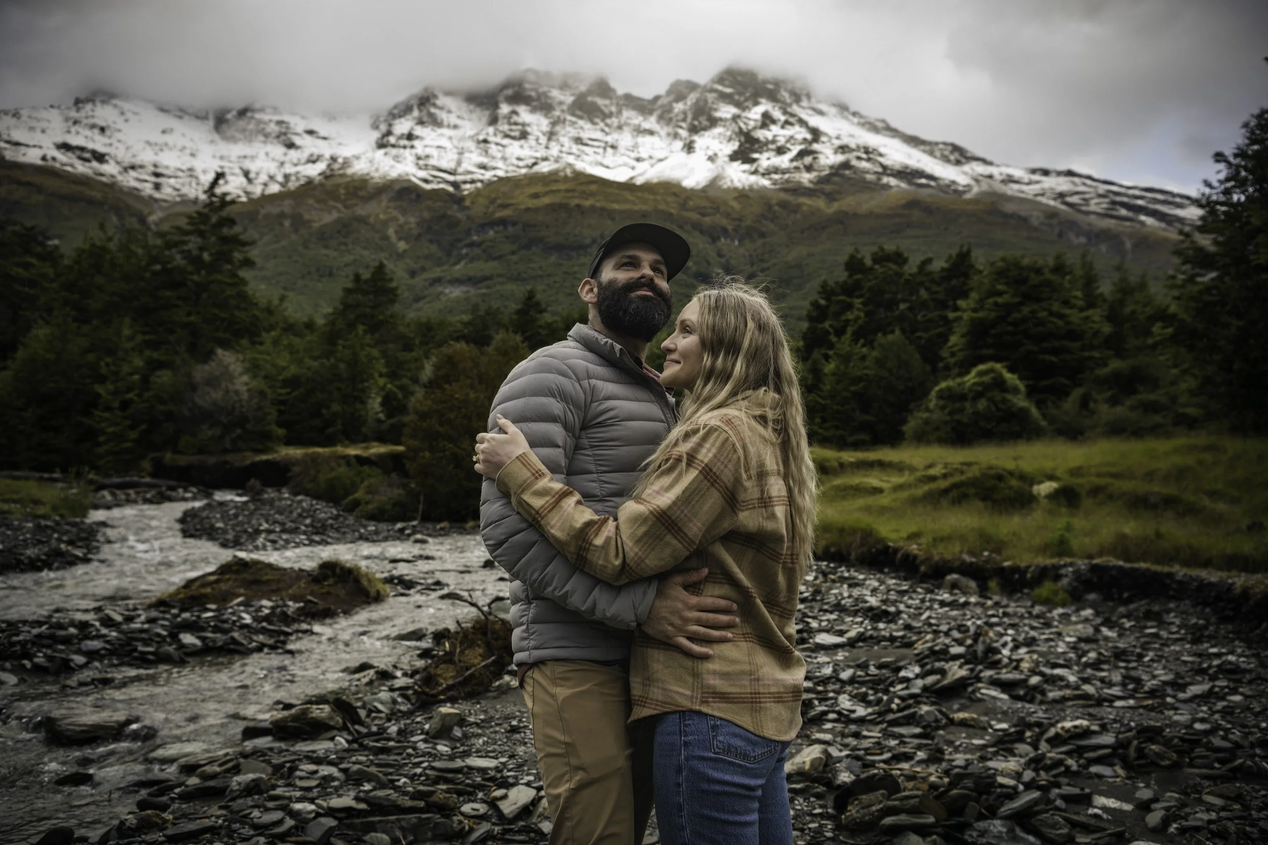 Adventurous honeymooning couple experiencing an adventure of a lifetime = proffessionally photographed, guided and driven thourhg Tāhuna - Queenstown, Glenorchy and beyond