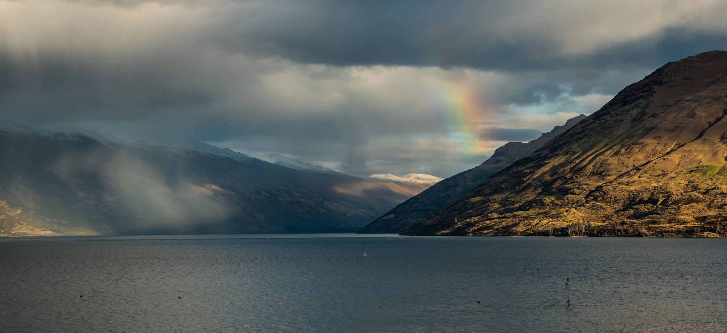 Rainbow over Lake Wakatipu captured during Queenstown wedding photography