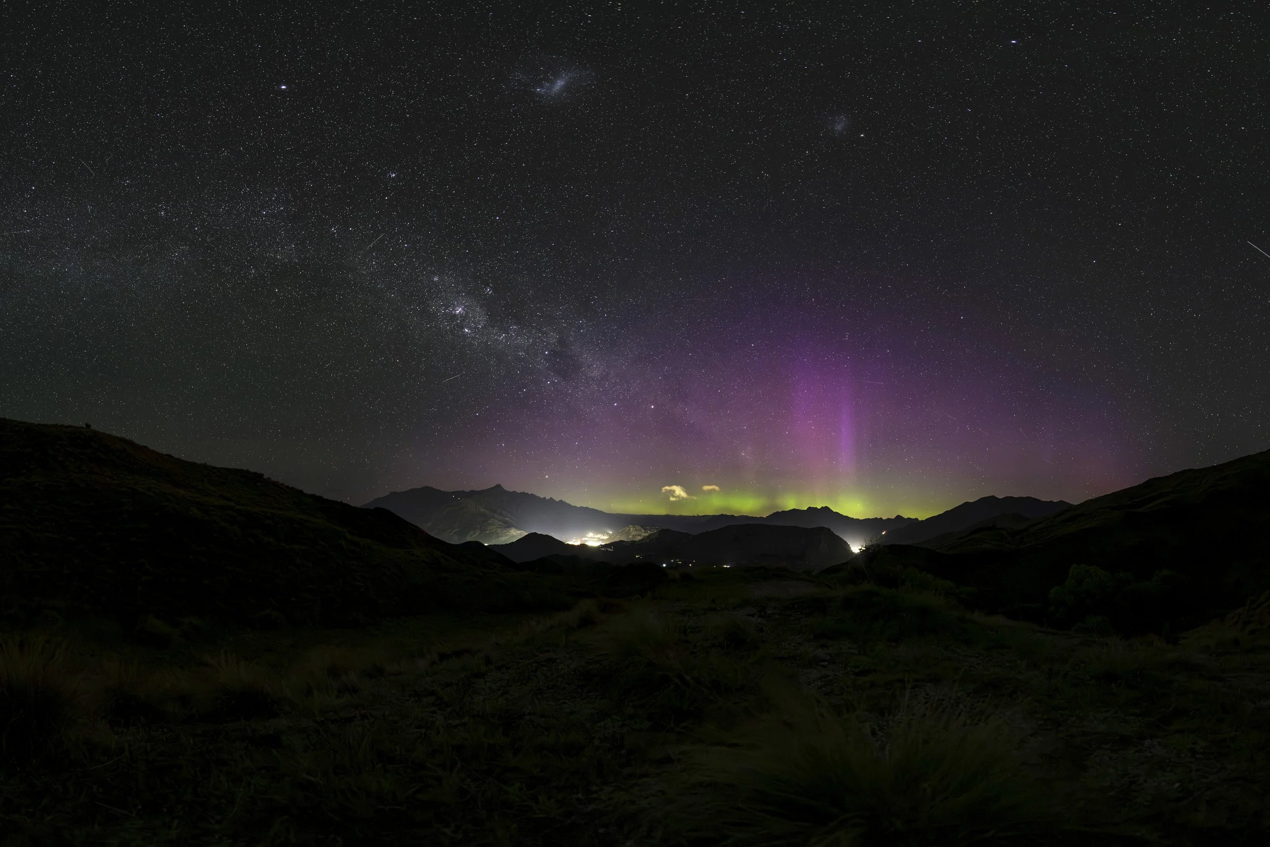 Looking South over the Whakatipu Basin at night with a stunning night sky and Aurora Australis