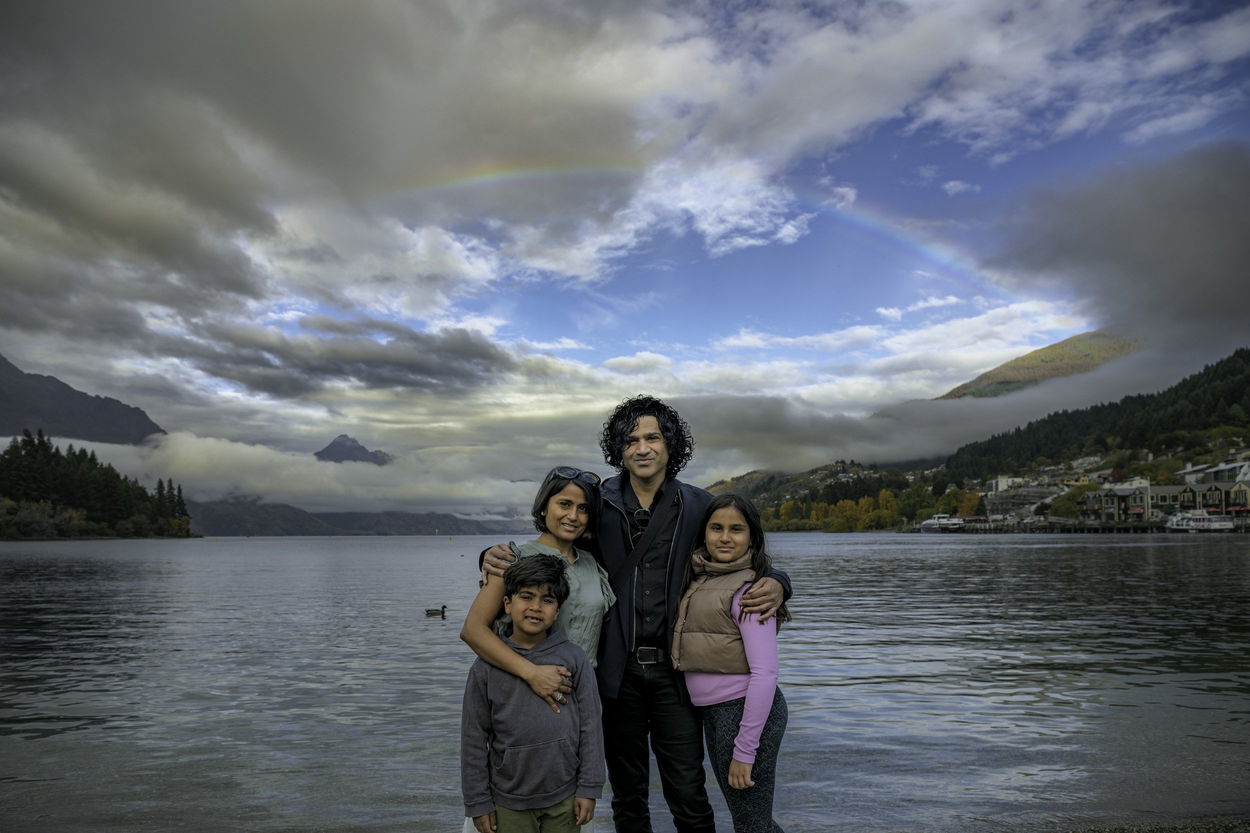 Family enjoying a private tour at Queenstown Bay with professional photography included